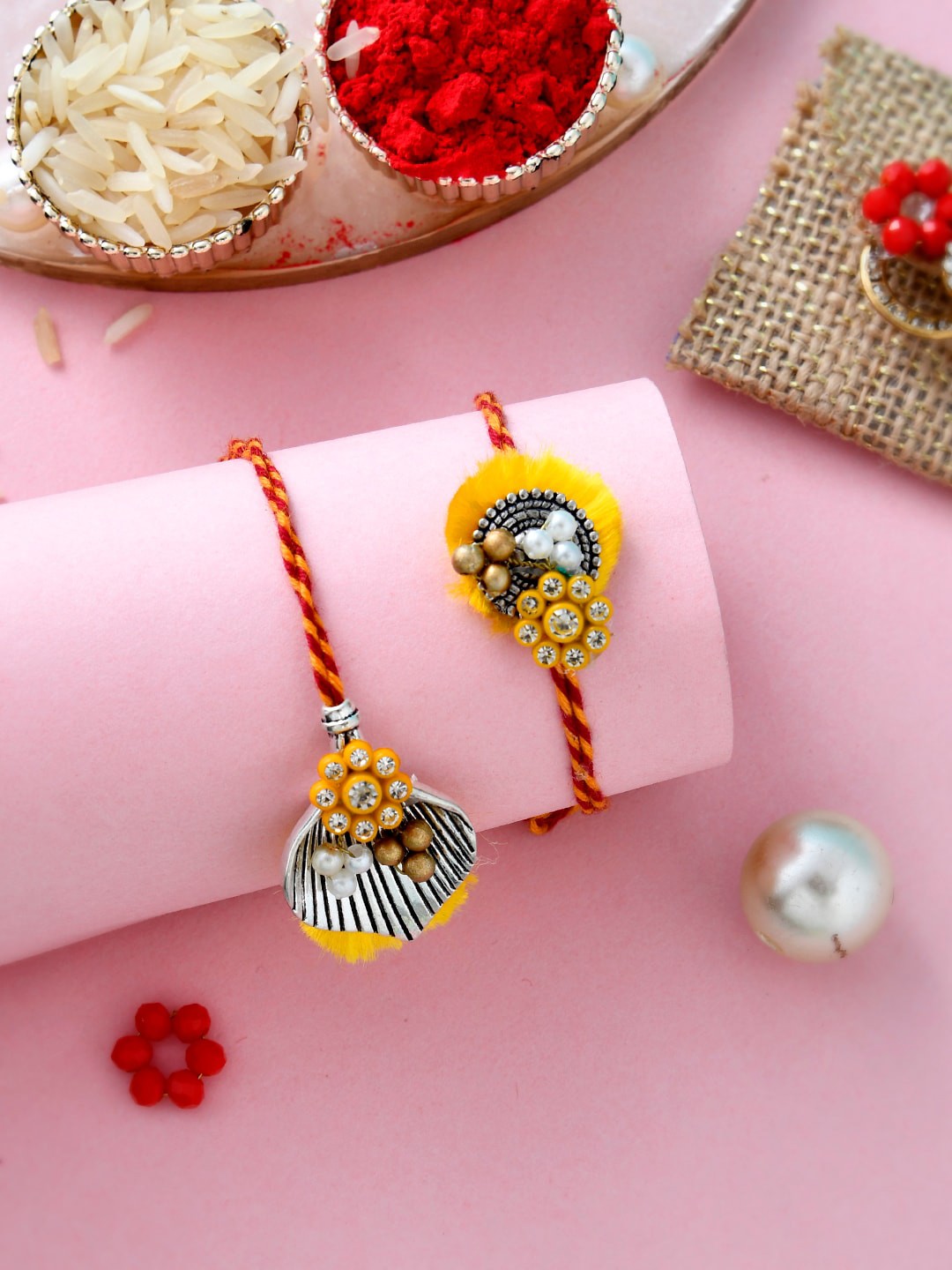 

Aapno Rajasthan Set Of 2 Beads Studded Rakhi With Roli Chawal & Box, Yellow