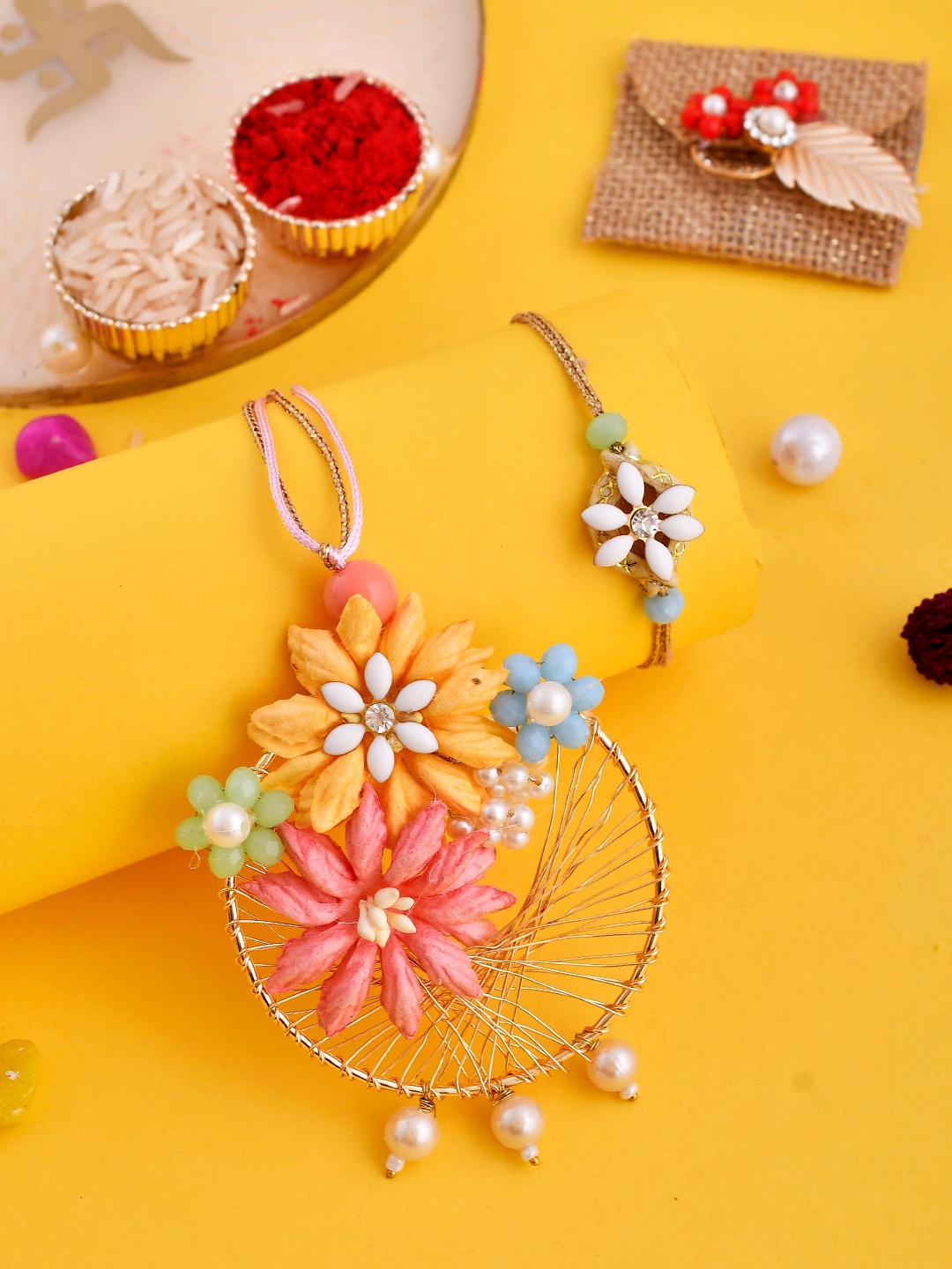 

Aapno Rajasthan Exclusively Pearl Crafted with Floral Design Bhaiya Bhabhi Rakhi Set, Pink