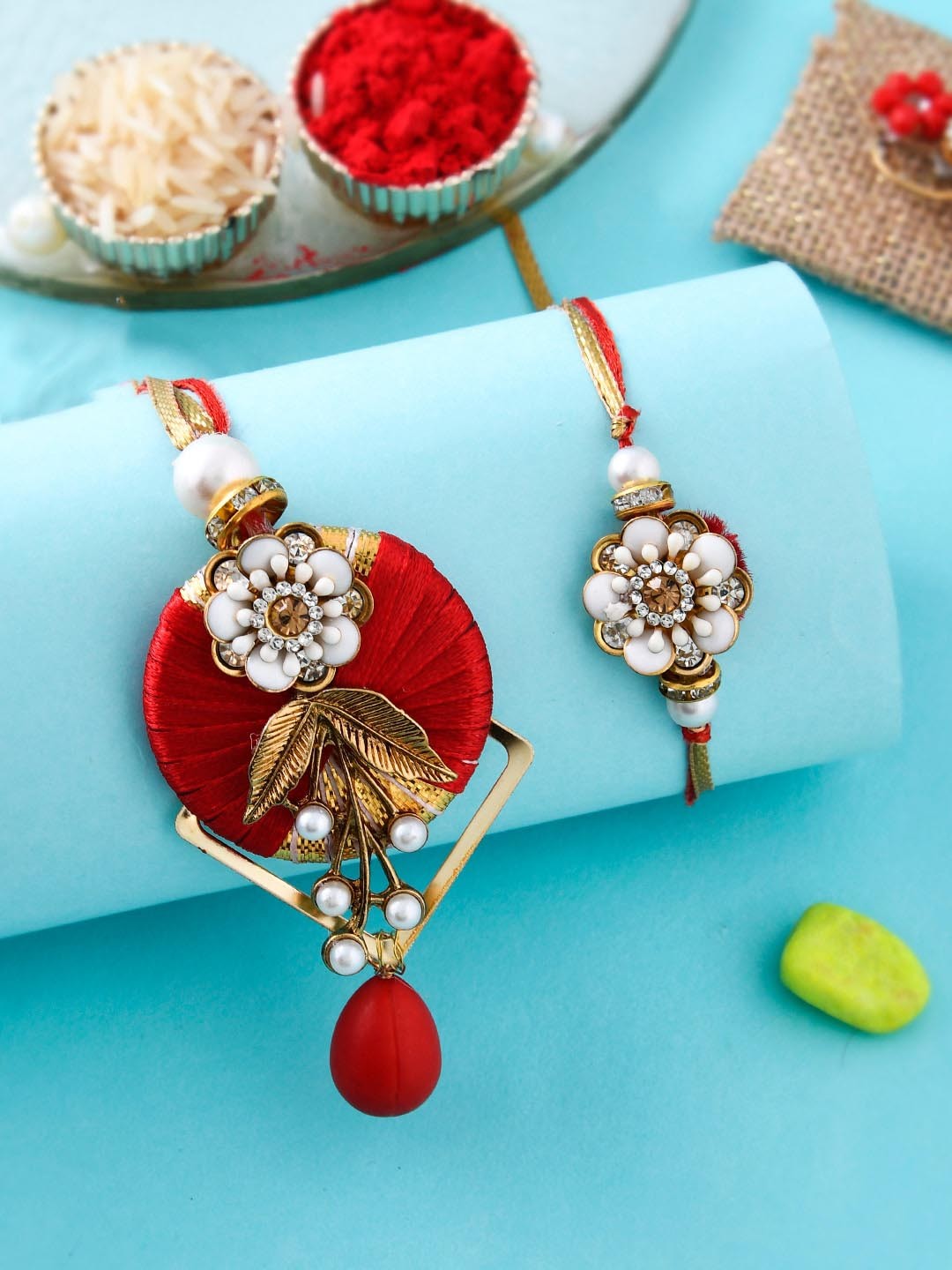 

Aapno Rajasthan Set Of 2 Embellished Bhaiya Bhabhi Rakhi Set With Box, Red