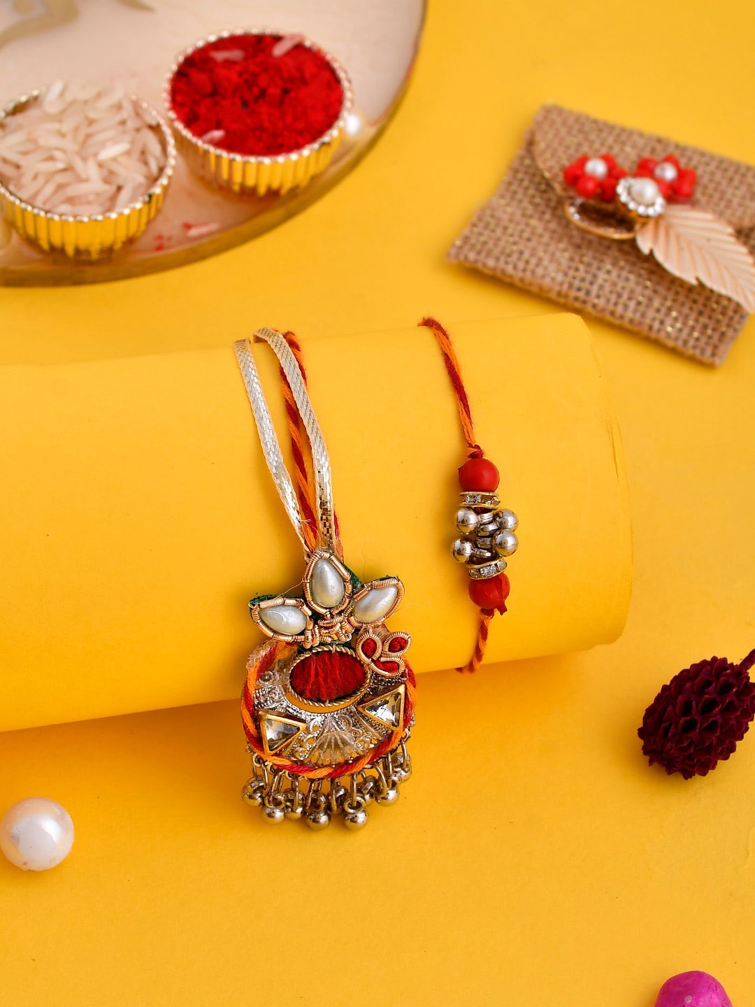 

Aapno Rajasthan Set Of 2 Pearl Embellished Bhaiya Bhabhi Rakhi Set With Box, Orange