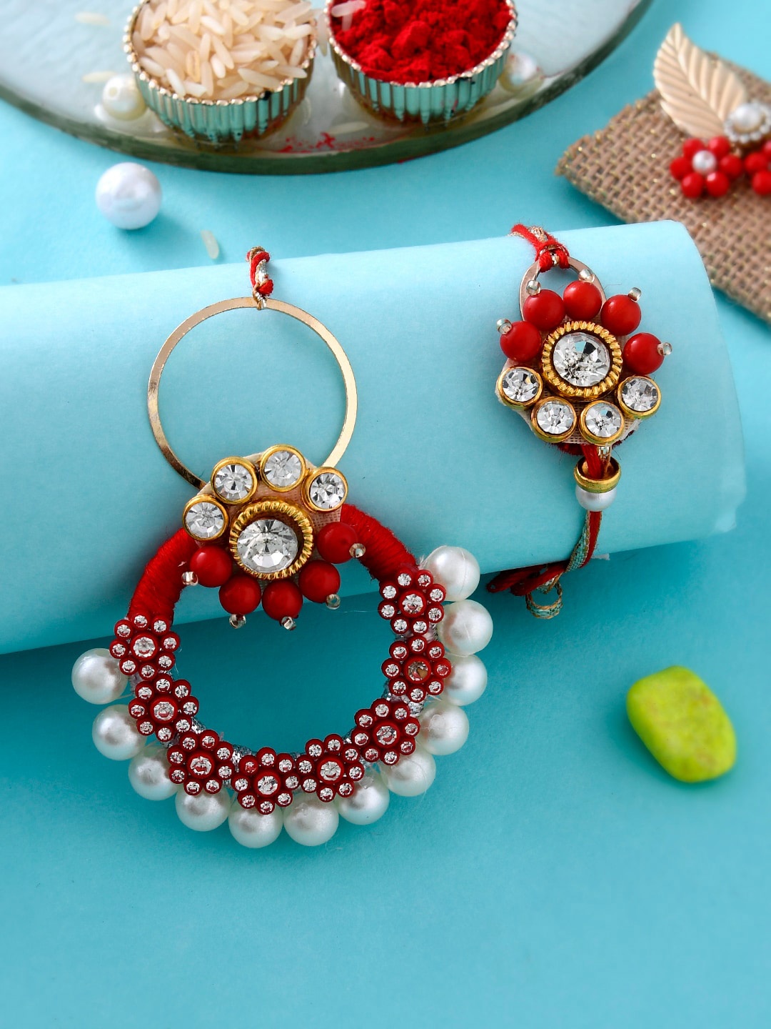 

Aapno Rajasthan Set Of 2 Pearl Embellished Bhaiya Bhabhi Rakhi Set With Box, Red