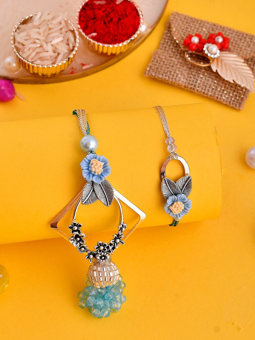 

Aapno Rajasthan Set Of 2 Pearl Embellished Bhaiya Bhabhi Rakhi Set With Box, Gold