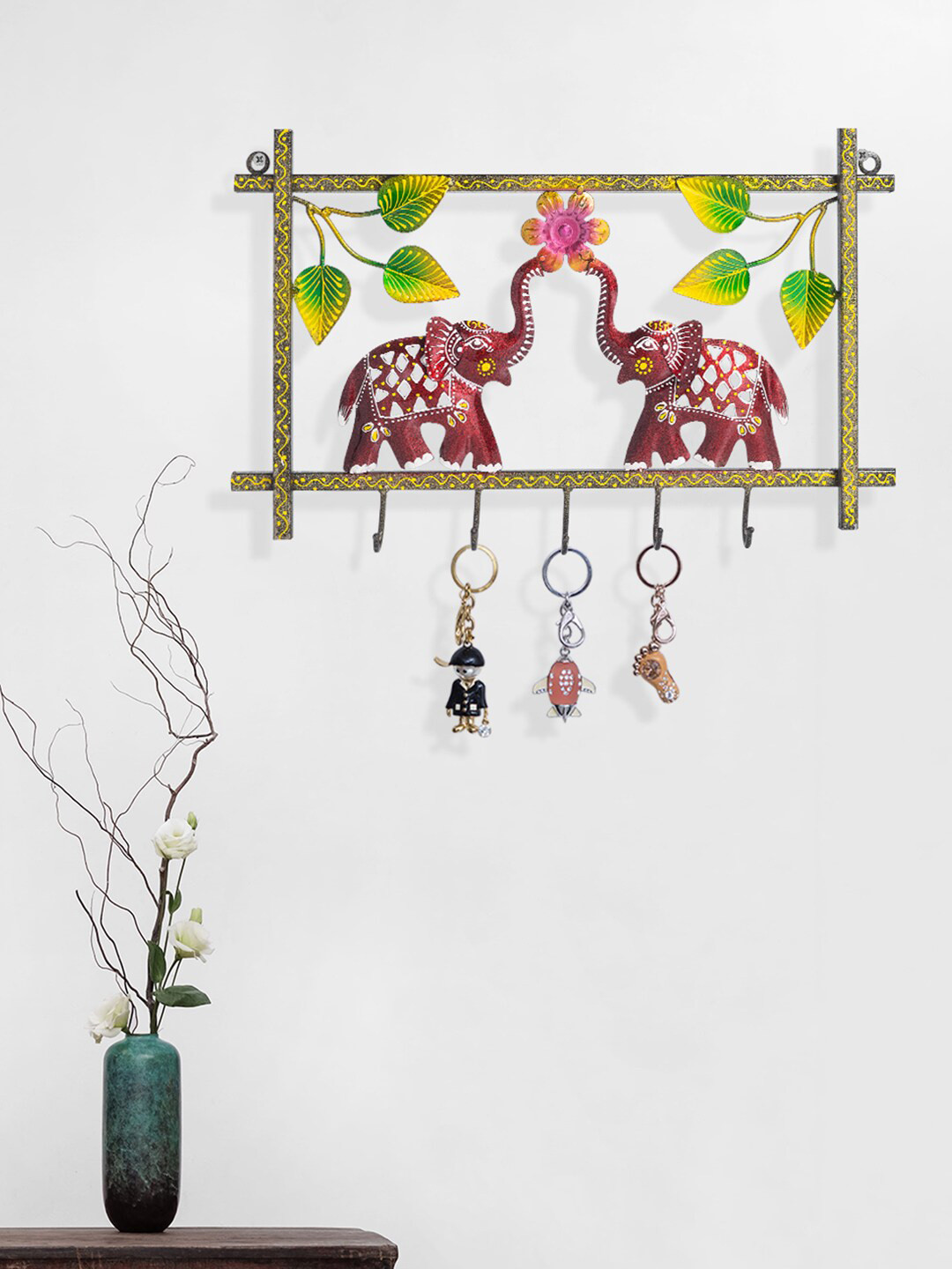 

Golden Peacock Maroon & Green Elephant Shaped Key Holders With 5 Key Knobs