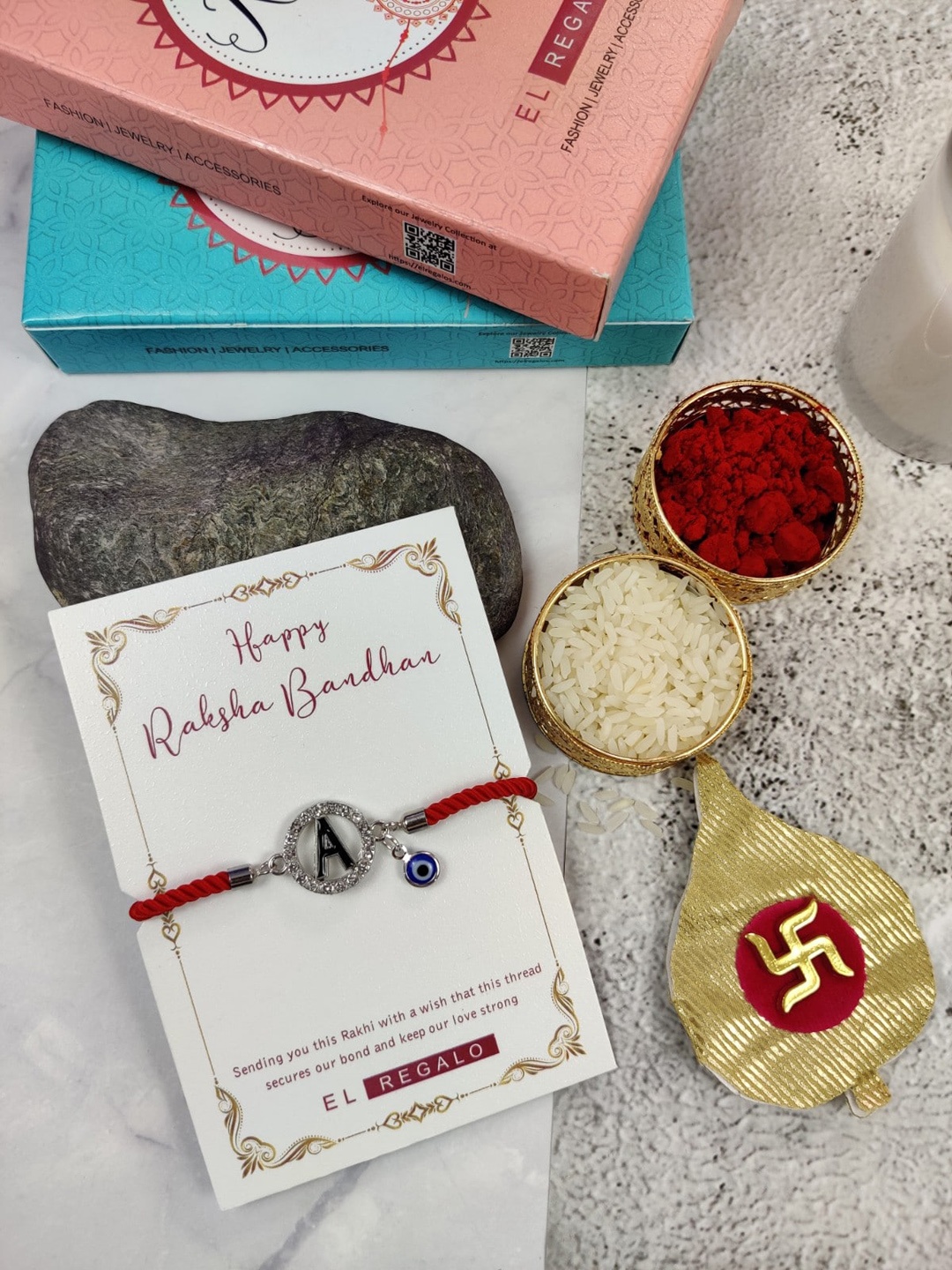 

EL REGALO A Name Initial Evil Eye Rakhi With Roli Chawal, Red