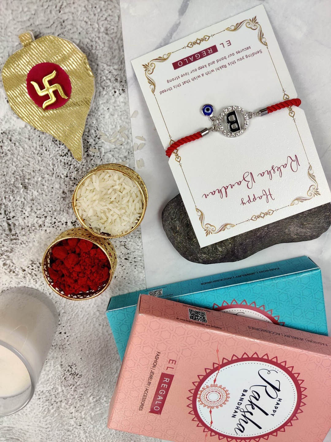 

EL REGALO B Name Initial Evil Eye Rakhi With Roli Chawal, Red