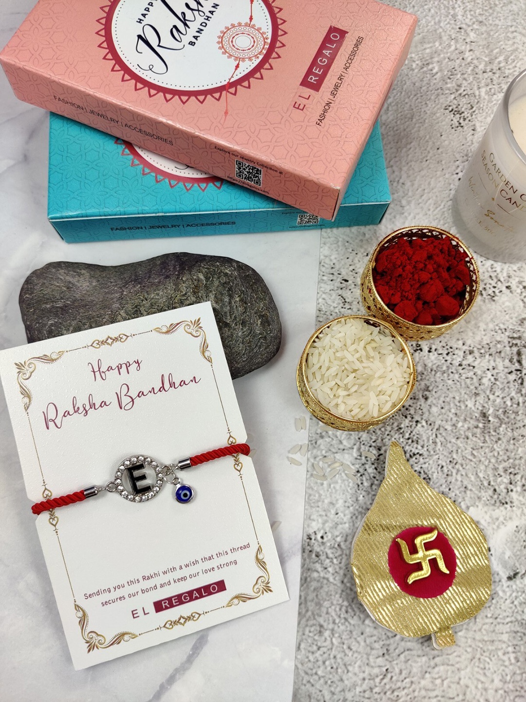 

EL REGALO E Name Initial Evil Eye Rakhi With Roli Chawal, Red