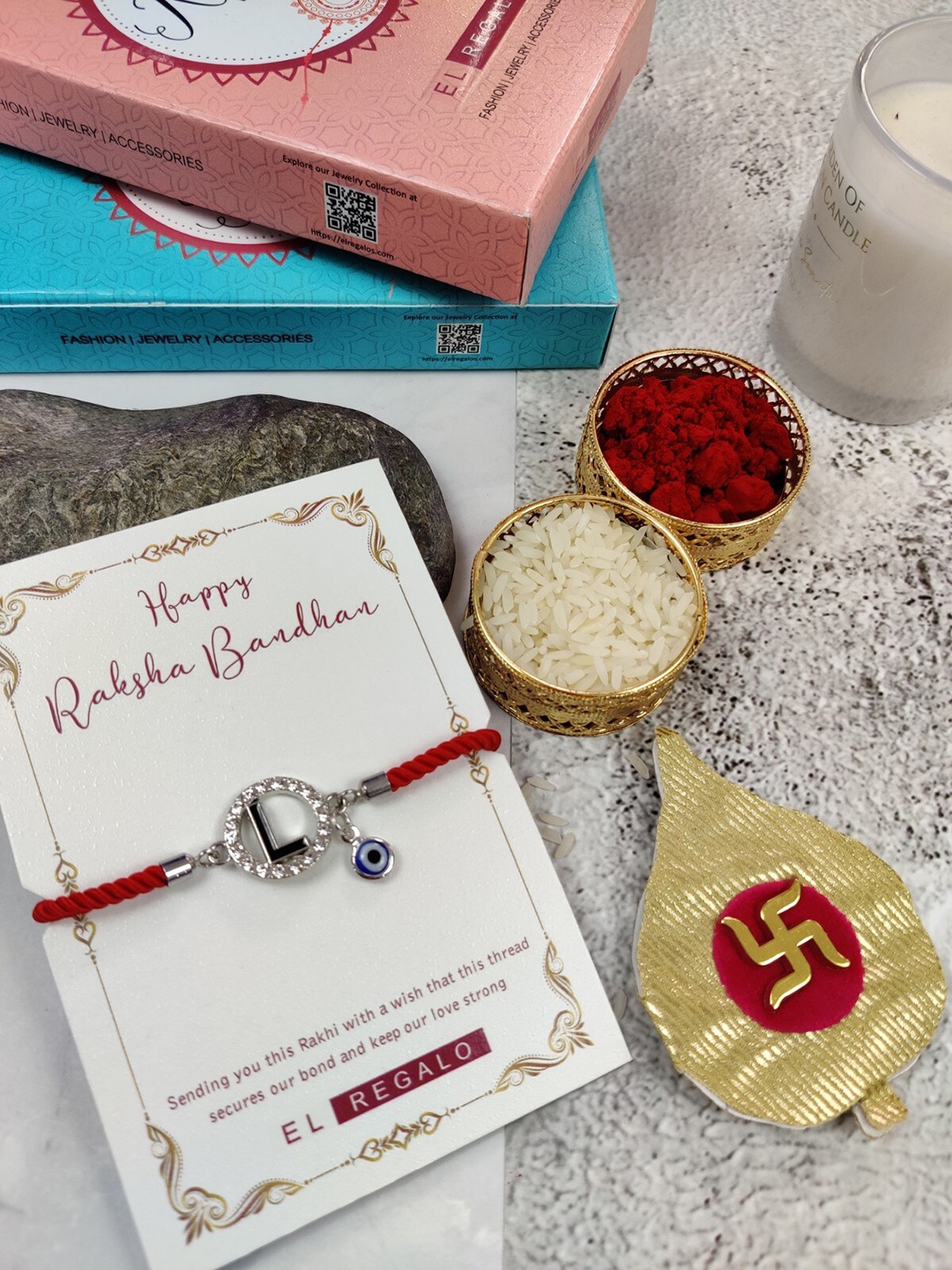 

EL REGALO L Name Initial Evil Eye Rakhi With Roli Chawal, Red