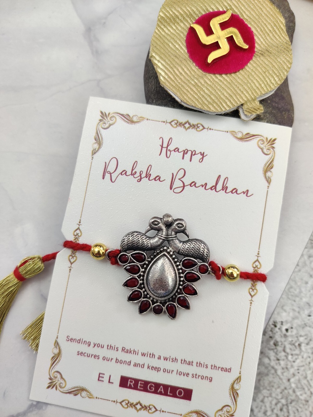 

EL REGALO Stones-Studded Peacock Charm Details Rakhi, Silver