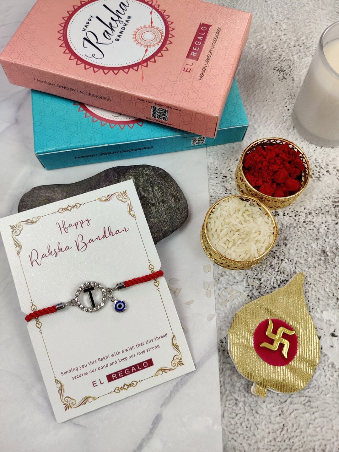 

EL REGALO T Name Initial Evil Eye Rakhi With Roli Chawal, Red