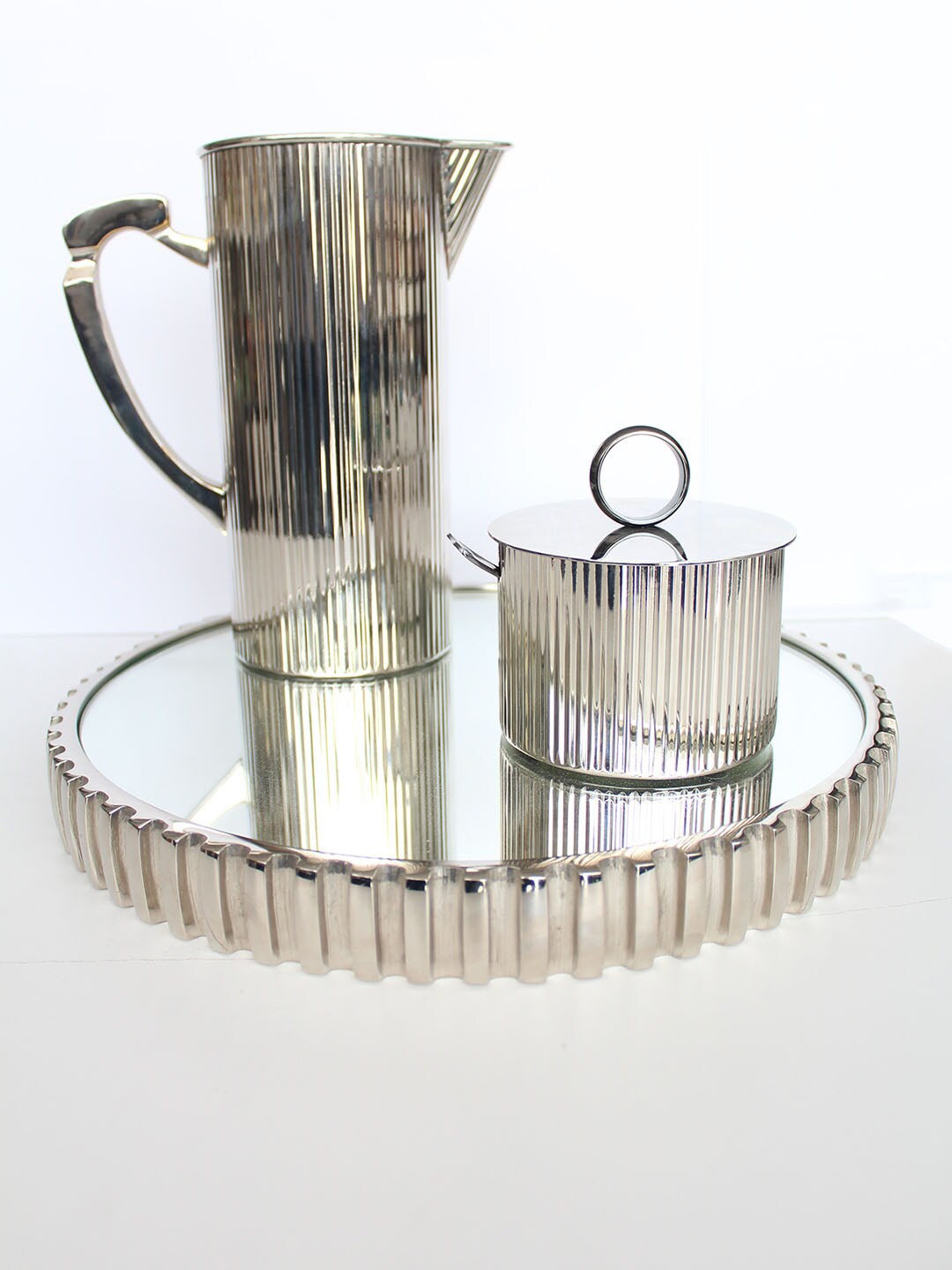

Izzhaar Silver Toned Ribbed Mirror Textured Steel Tray Platter