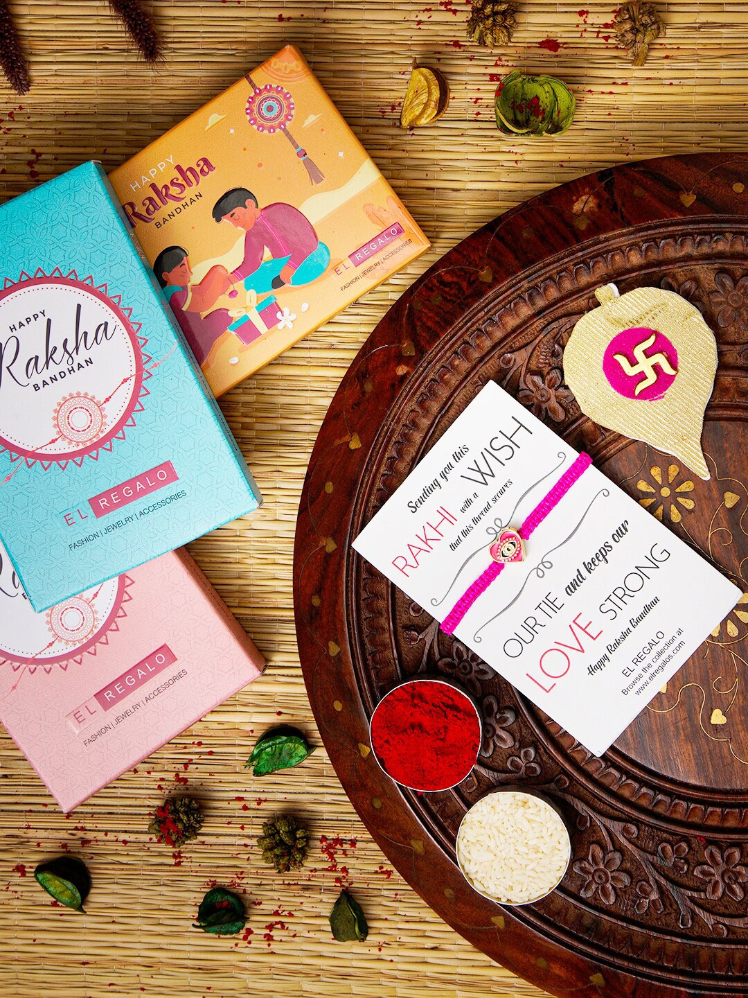 

EL REGALO Evil Eye Name Initial Rakhi With Roli chawal Card, Pink