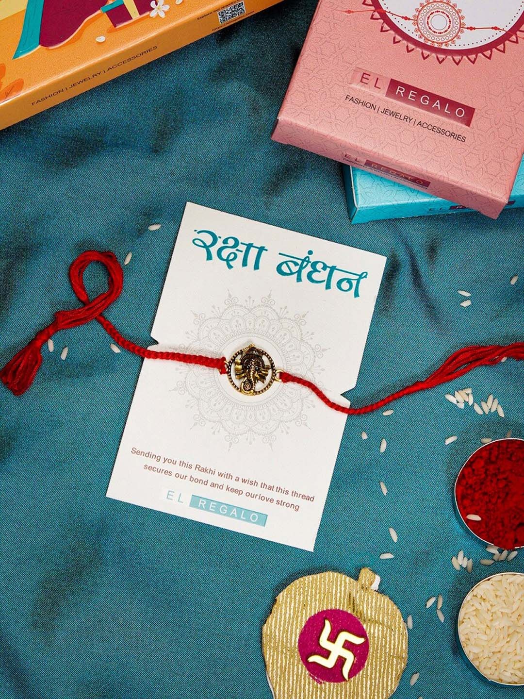 

EL REGALO Lord Ganesh Charm Detail Rakhi With Roli Rice & Greeting Card, Red