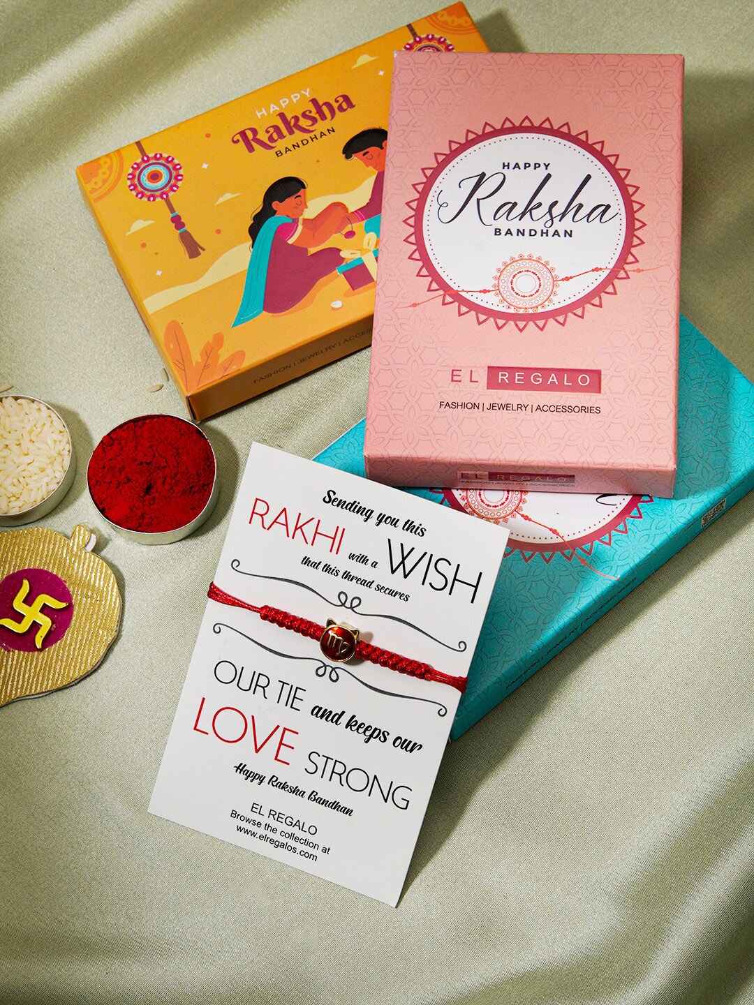 

EL REGALO Zodiac Sign Detail Rakhi With Roli Rice & Greeting Card, Red