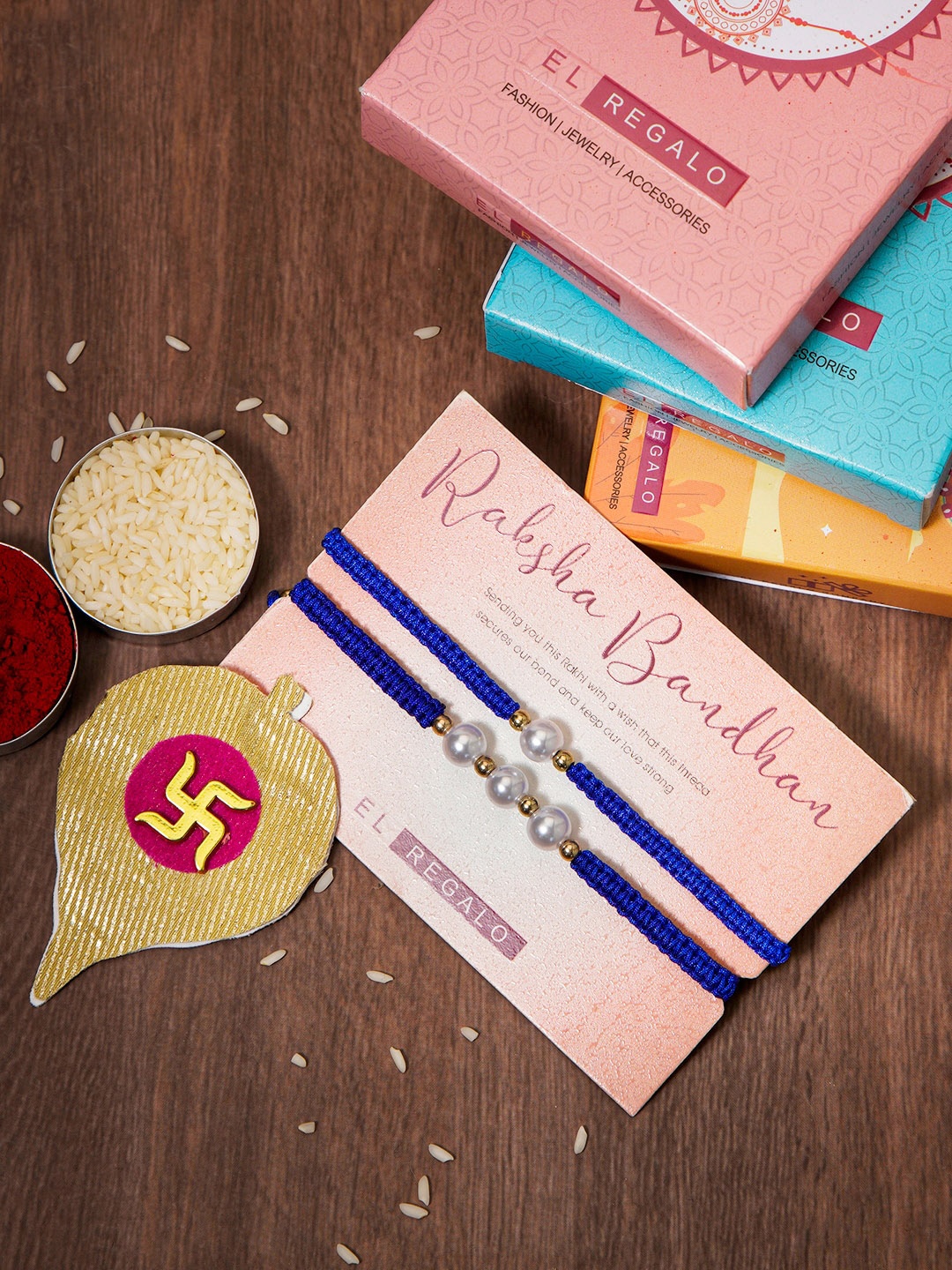 

EL REGALO Set Of 2 Pearl bhaiya and bhabhi Rakhi With Roli Rice, Blue