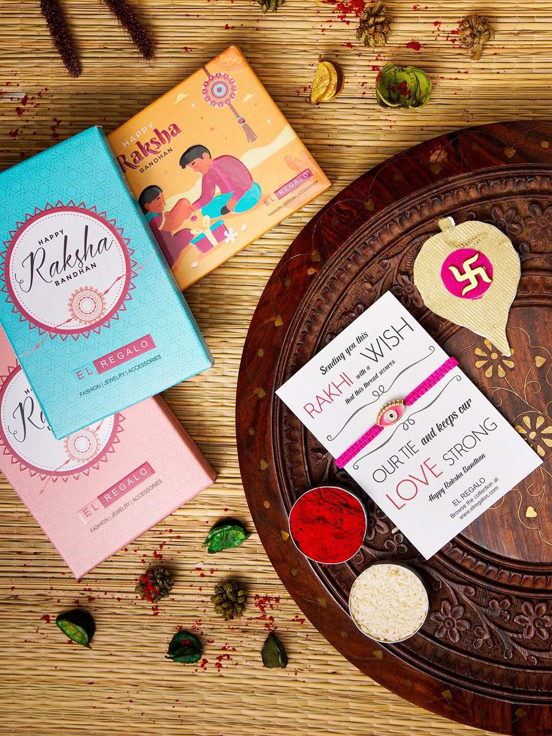 

EL REGALO Evil Eye Name Initial Rakhi With Roli chawal Card, Pink
