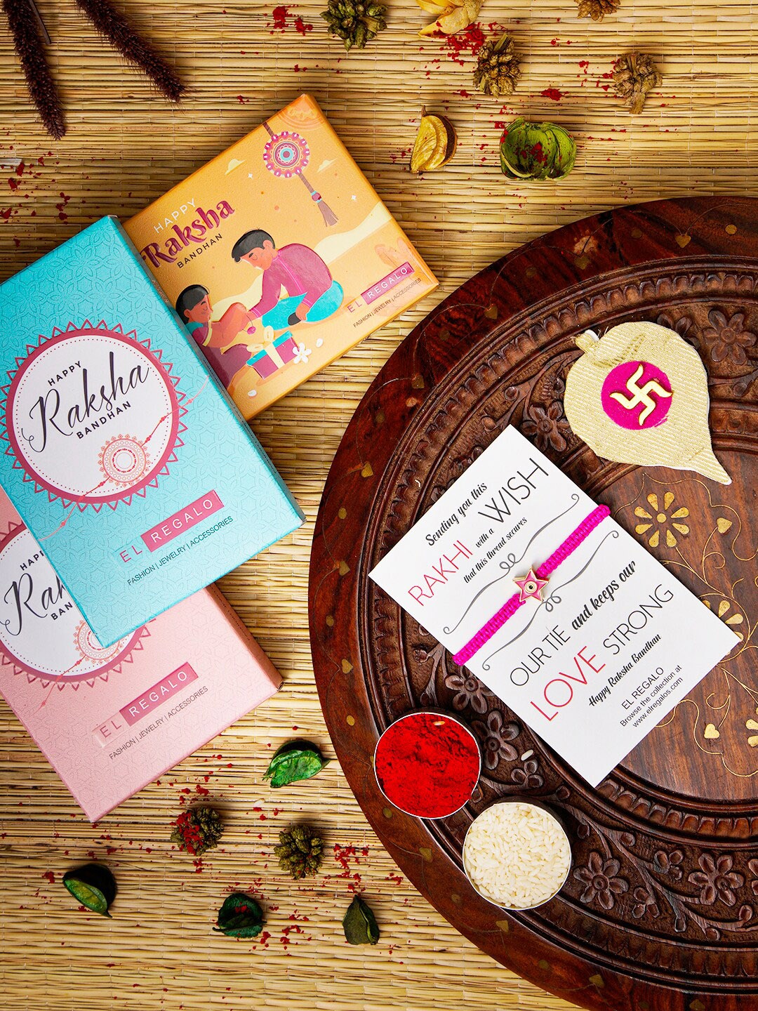 

EL REGALO Evil Eye Name Initial Rakhi With Roli chawal Card, Pink