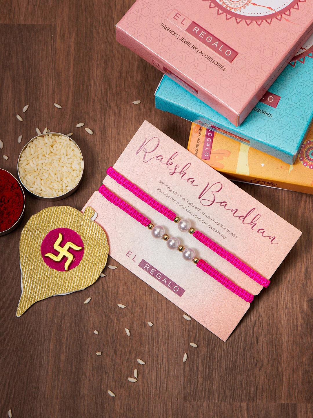 

EL REGALO Set Of 2 Rakhis for bhaiya bhabhi With Roli Rice and Rakhi Card, Pink