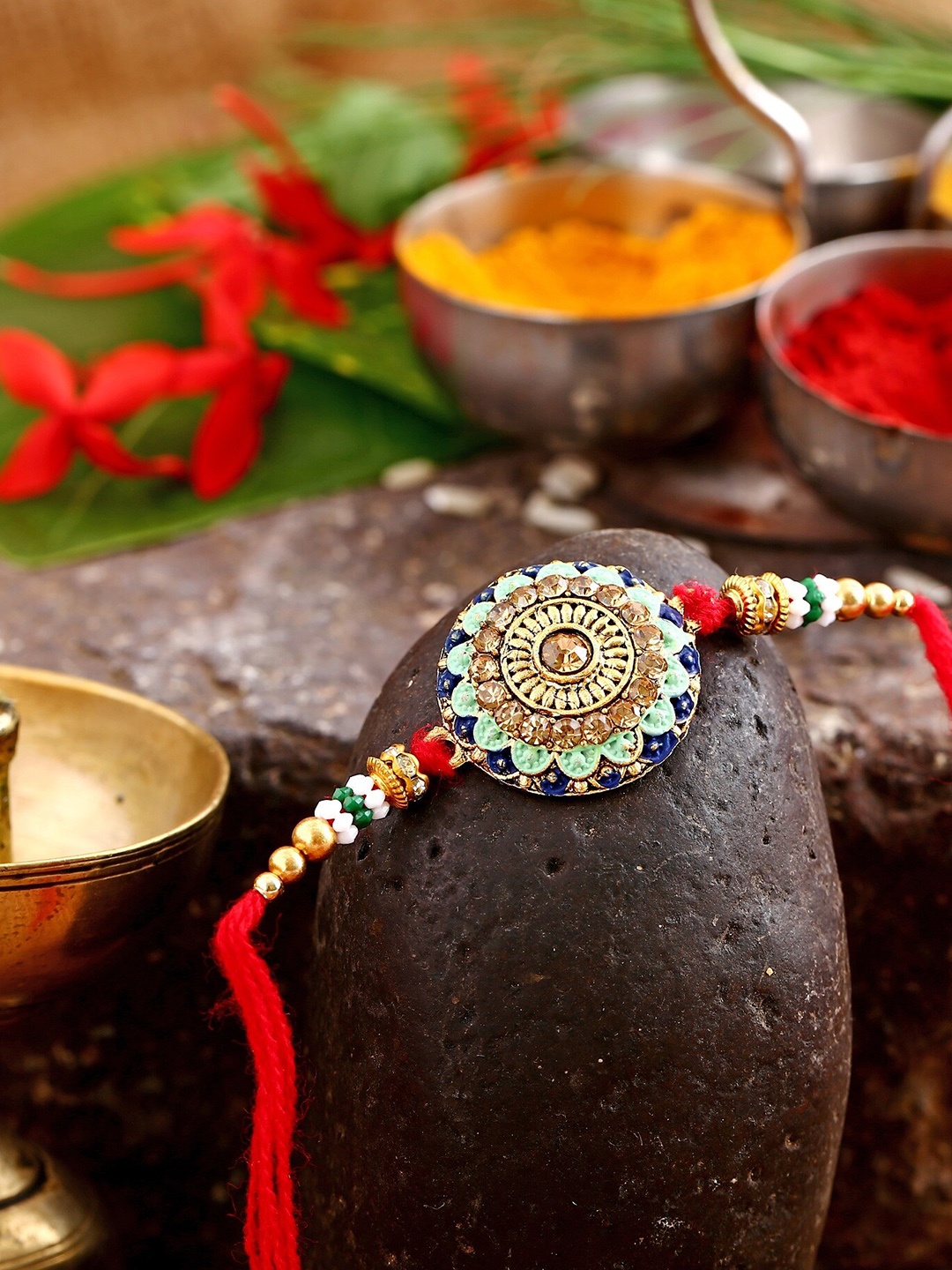 

Vighnaharta Boys Gold-Plated Floral Design Charm Tie-Up Rakhi