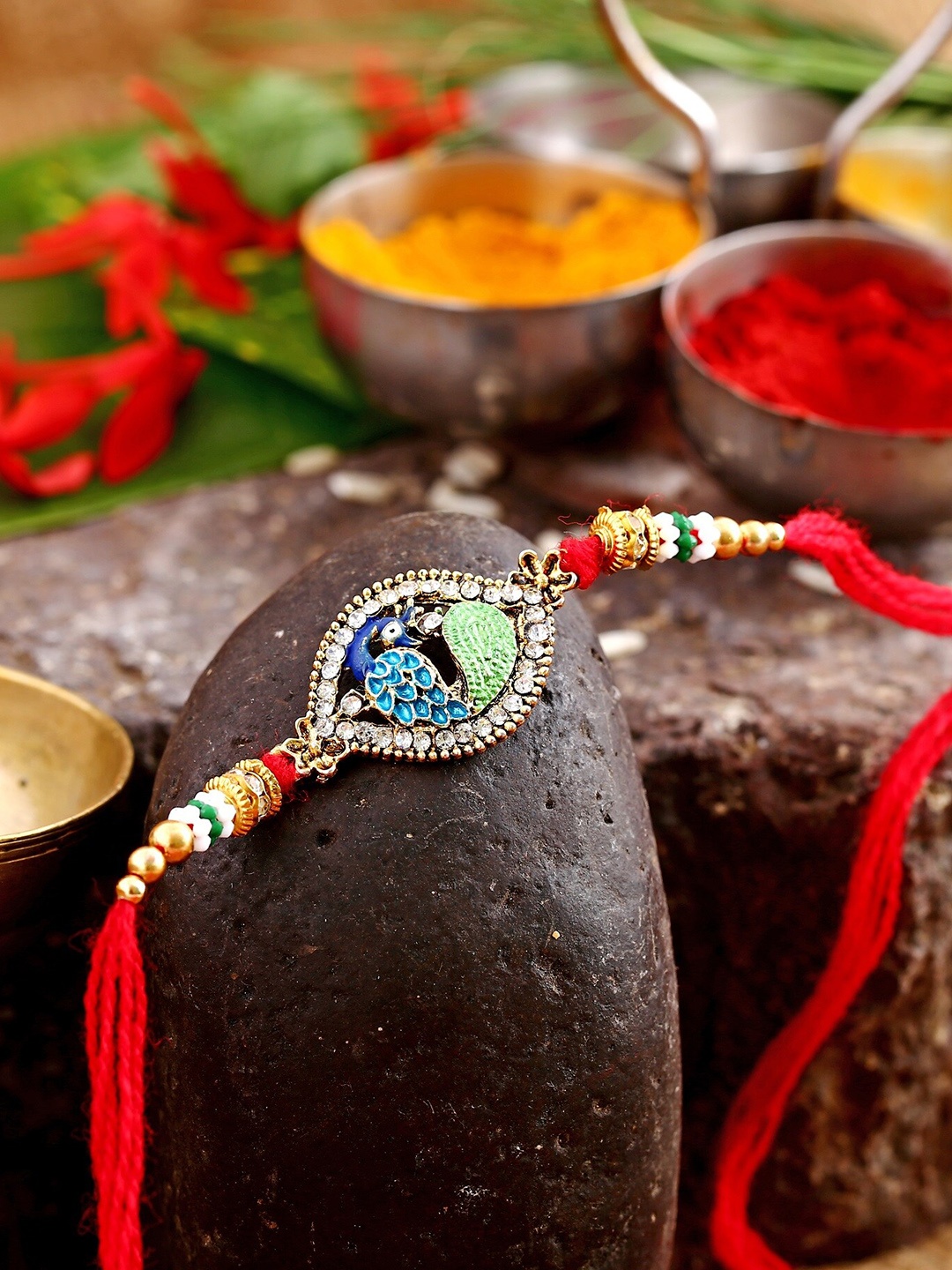 

Vighnaharta Boys Gold-Plated Charm Tie-Up Rakhi With Kumkum Leaf Set