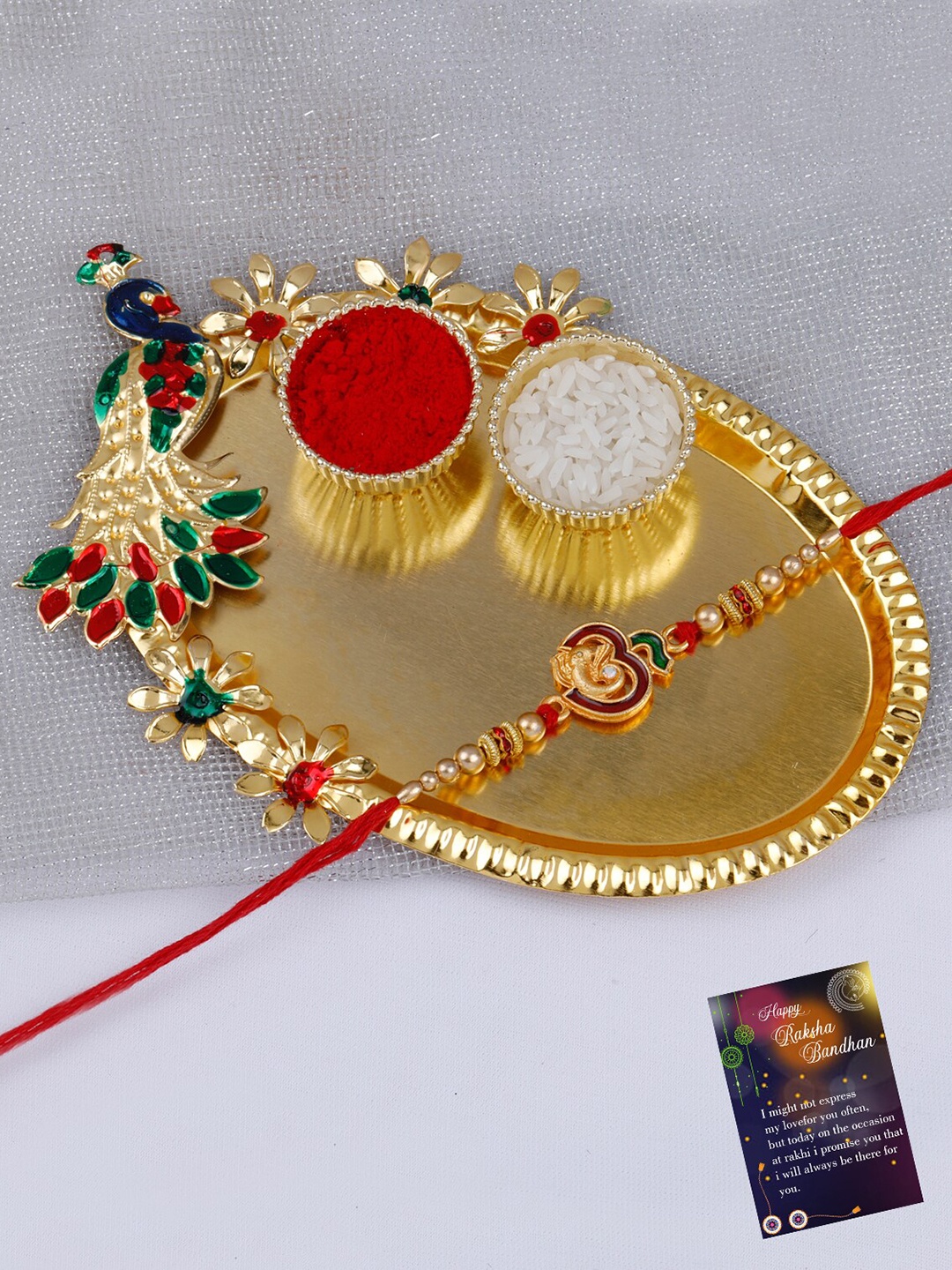 

Silver Shine Om Ganesh Charm Rakhi With Roli Chawal & Greeting Card, Gold