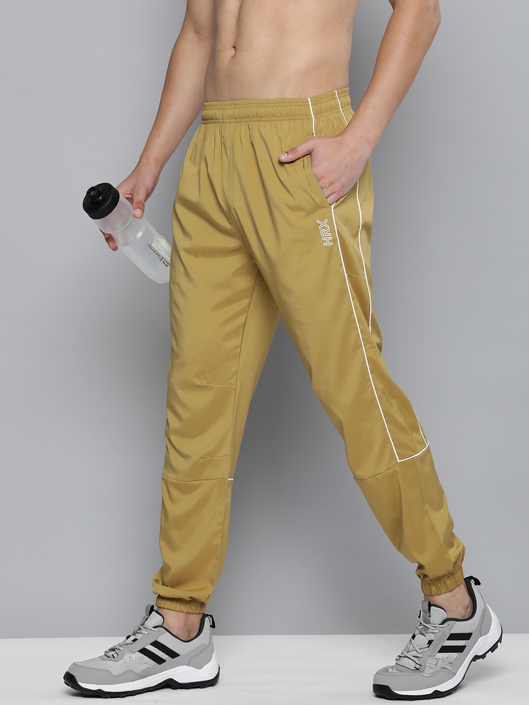 

HRX by Hrithik Roshan Men Mid-Rise Rapid-Dry Anti-Microbial Training Joggers, Mustard