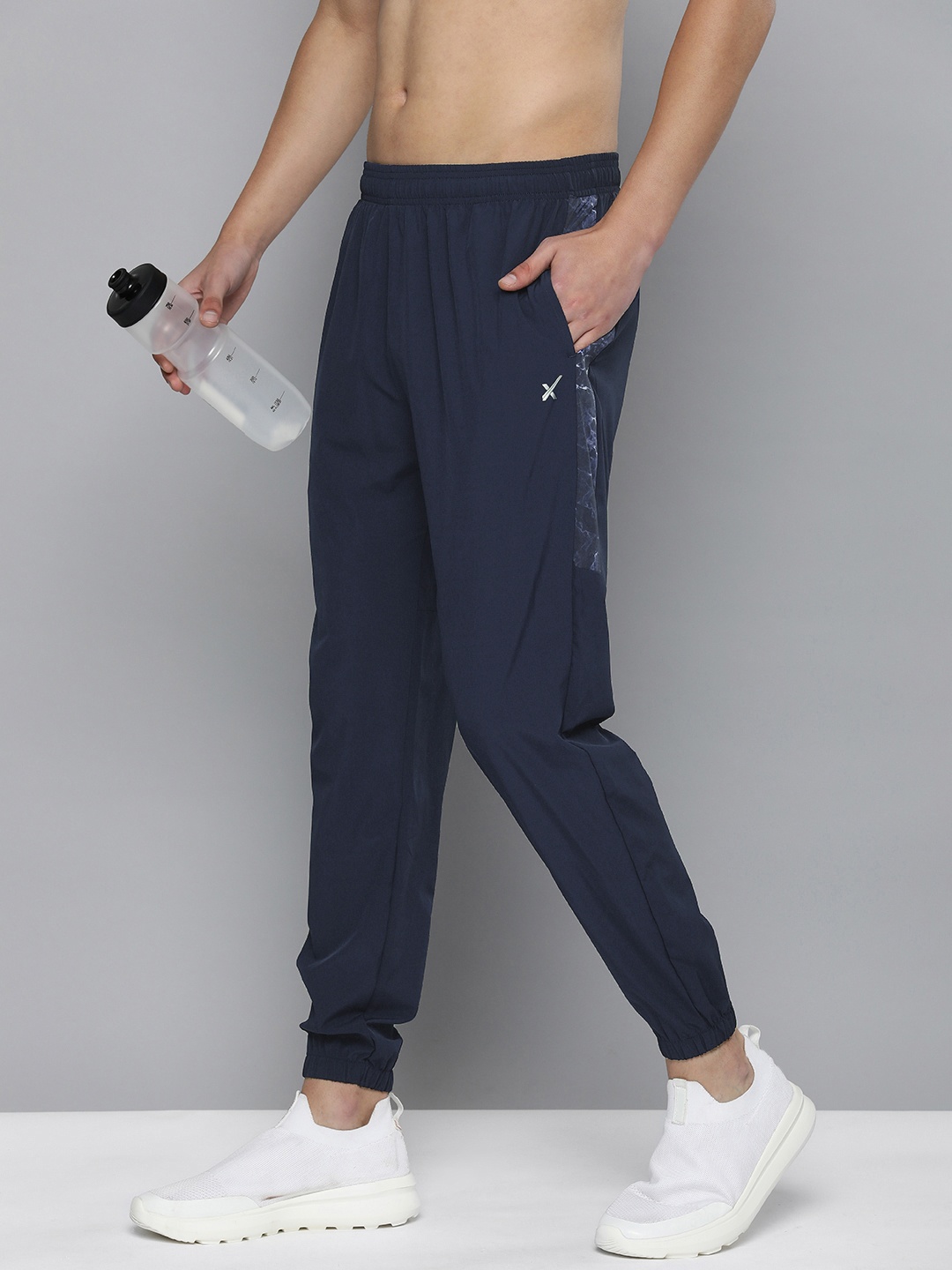 

HRX by Hrithik Roshan Men Solid Rapid-Dry Running Track Pants With Side Prints, Blue