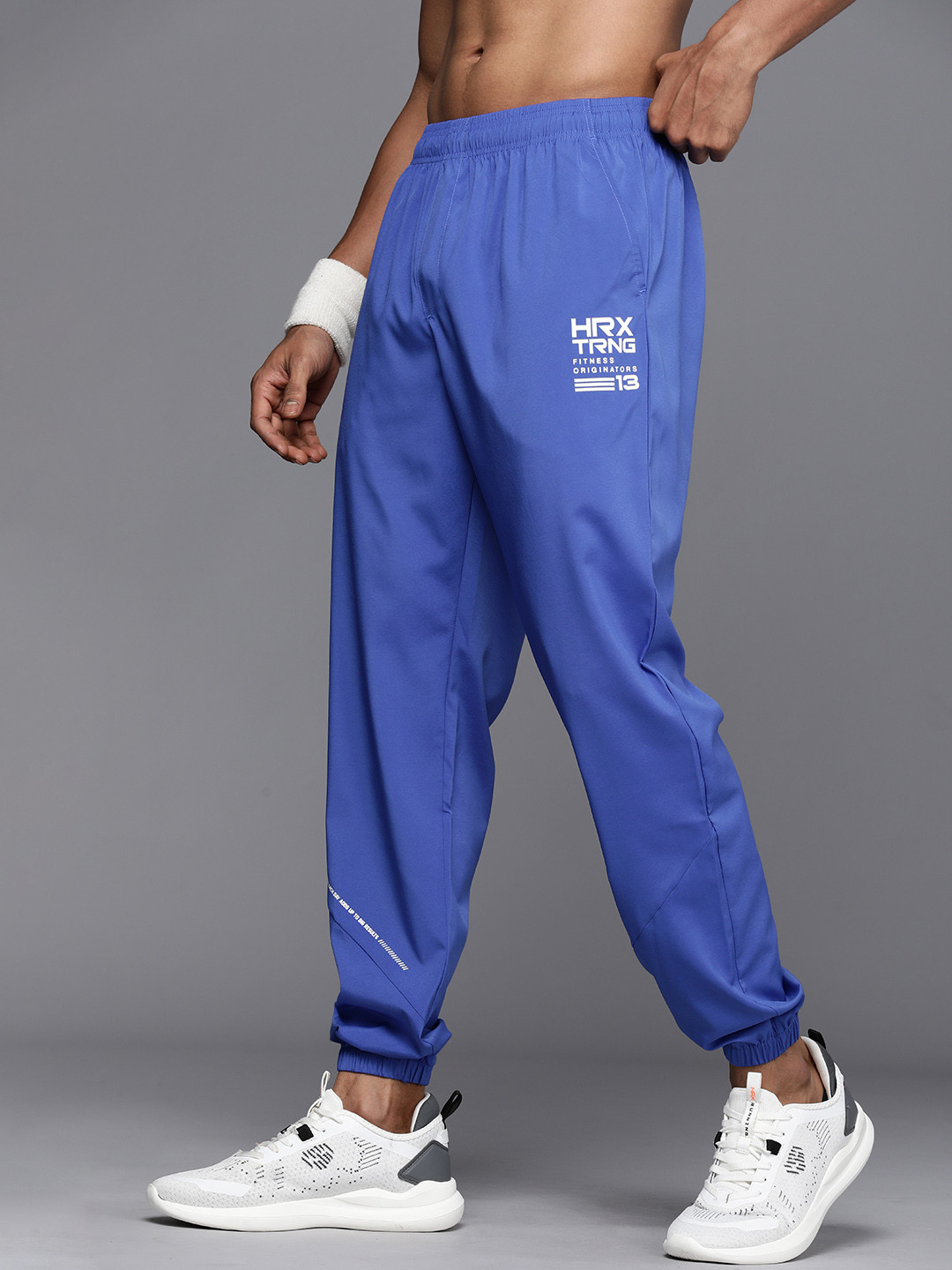 

HRX by Hrithik Roshan Men Brand Logo Printed Rapid-Dry Antimicrobial Training Joggers, Blue
