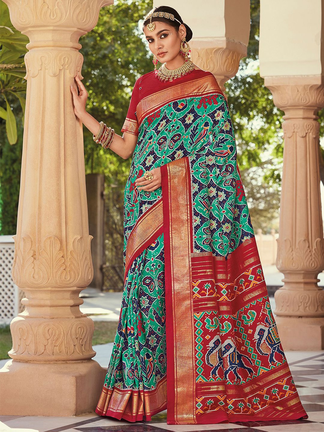 

Mitera Green & Red Ethnic Motifs Printed Zari Saree