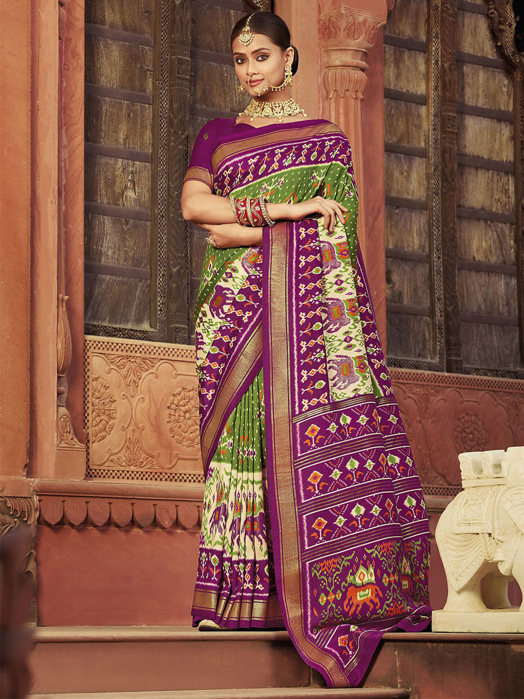 

Mitera Green & Purple Ethnic Motifs Printed Zari Saree