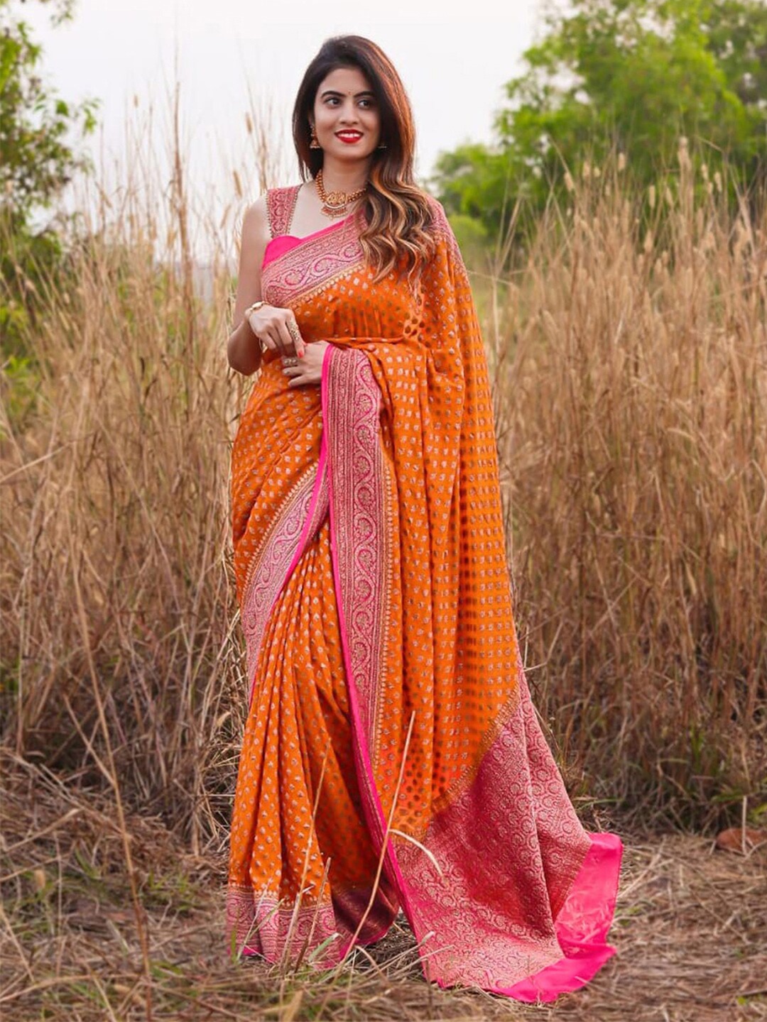 

Mitera Orange & Pink Ethnic Motifs Woven Design Zari Saree