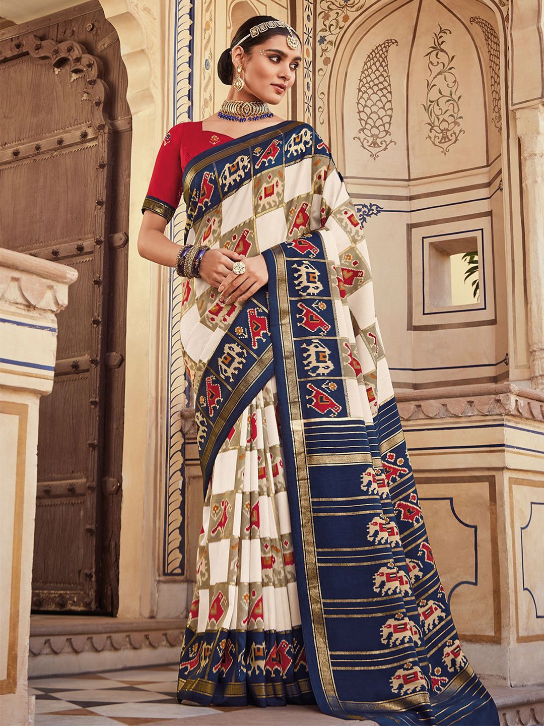 

Mitera White & Blue Ethnic Motifs Printed Zari Saree