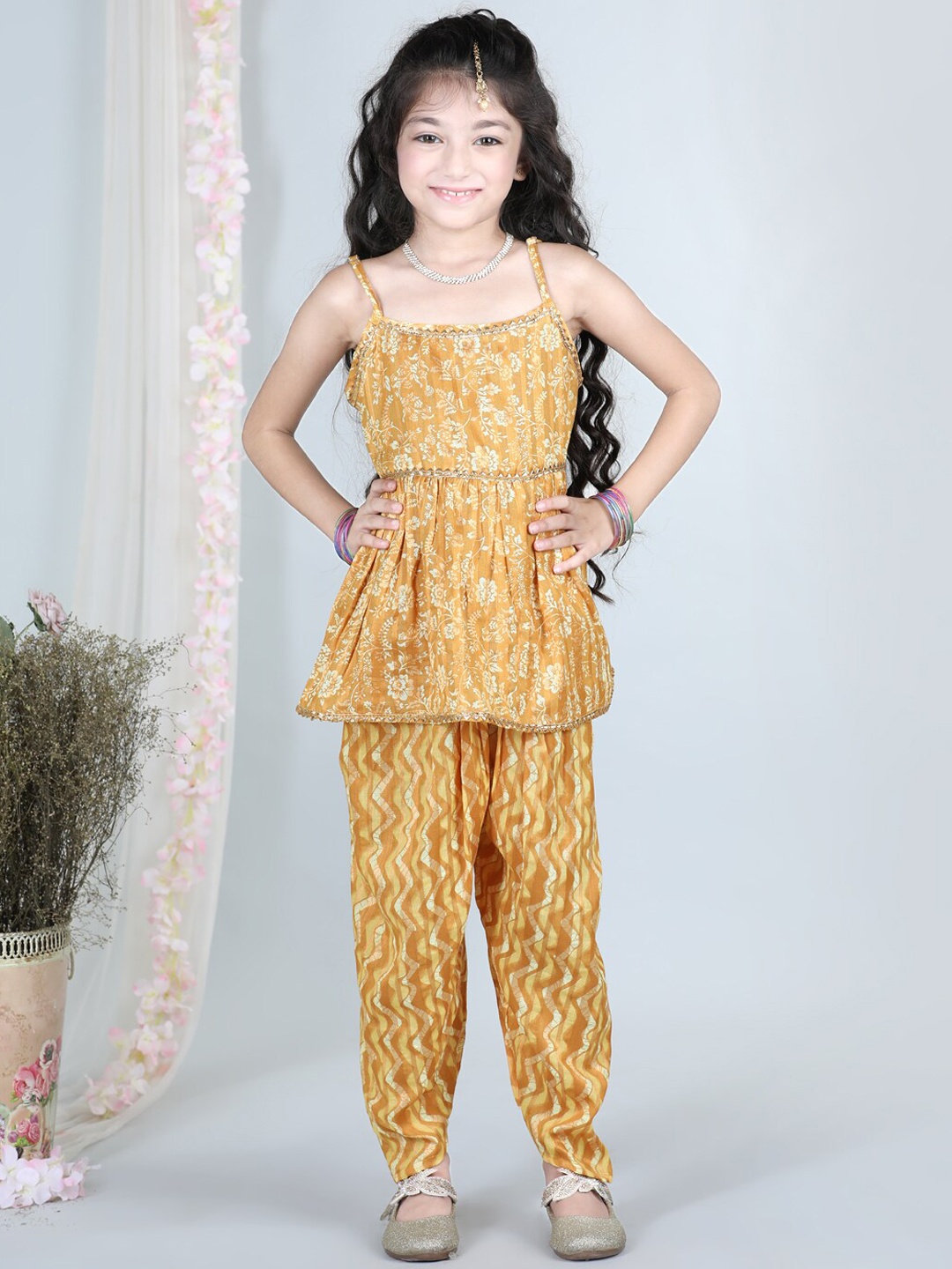 

Cutiekins Girls Shoulder Straps Floral Printed Pleated Gotta Patti Kurta with Dhoti Pants, Mustard