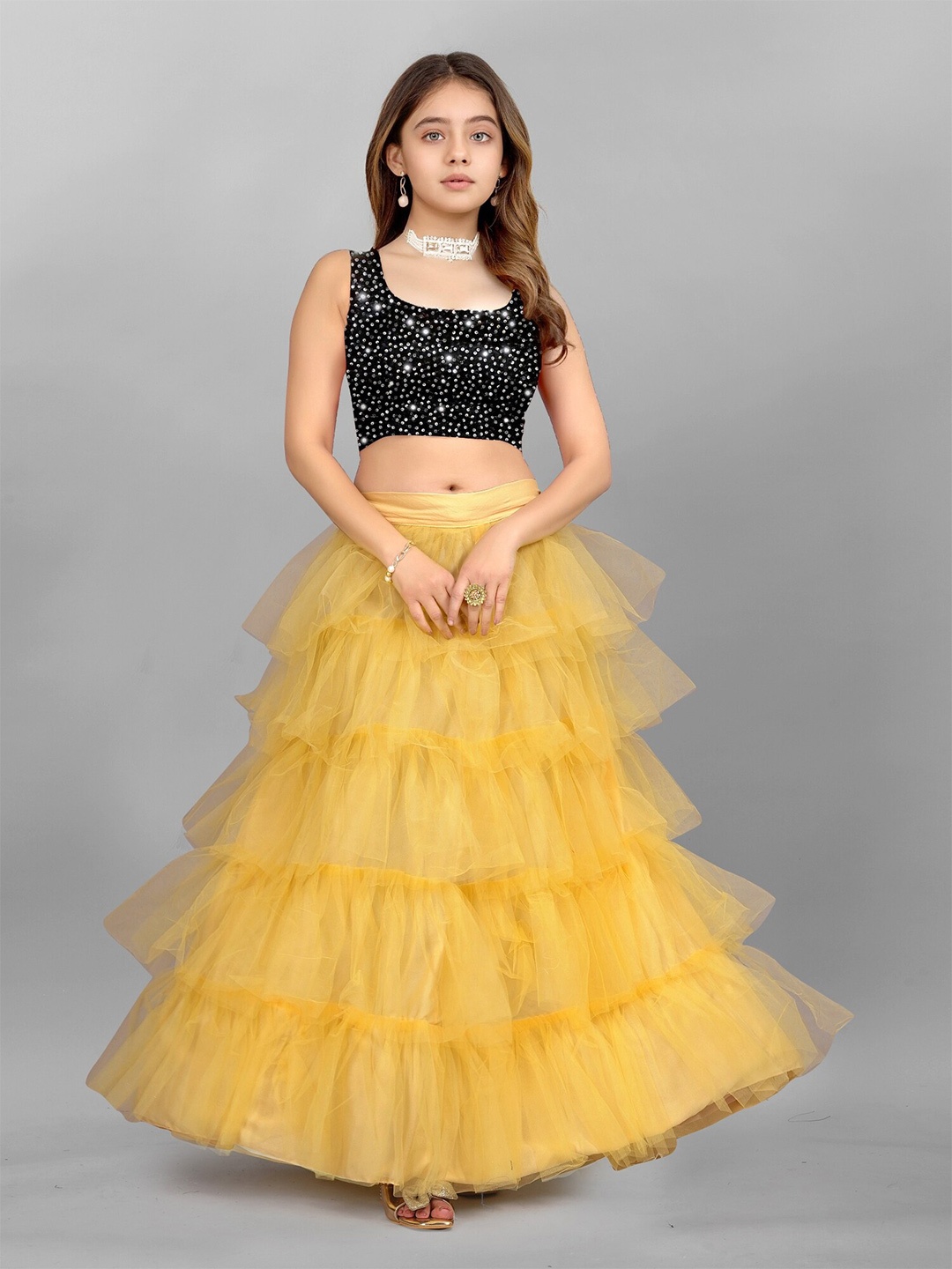 

APNISHA Girls Yellow & Black Sequinned Semi-Stitched Lehenga & Unstitched