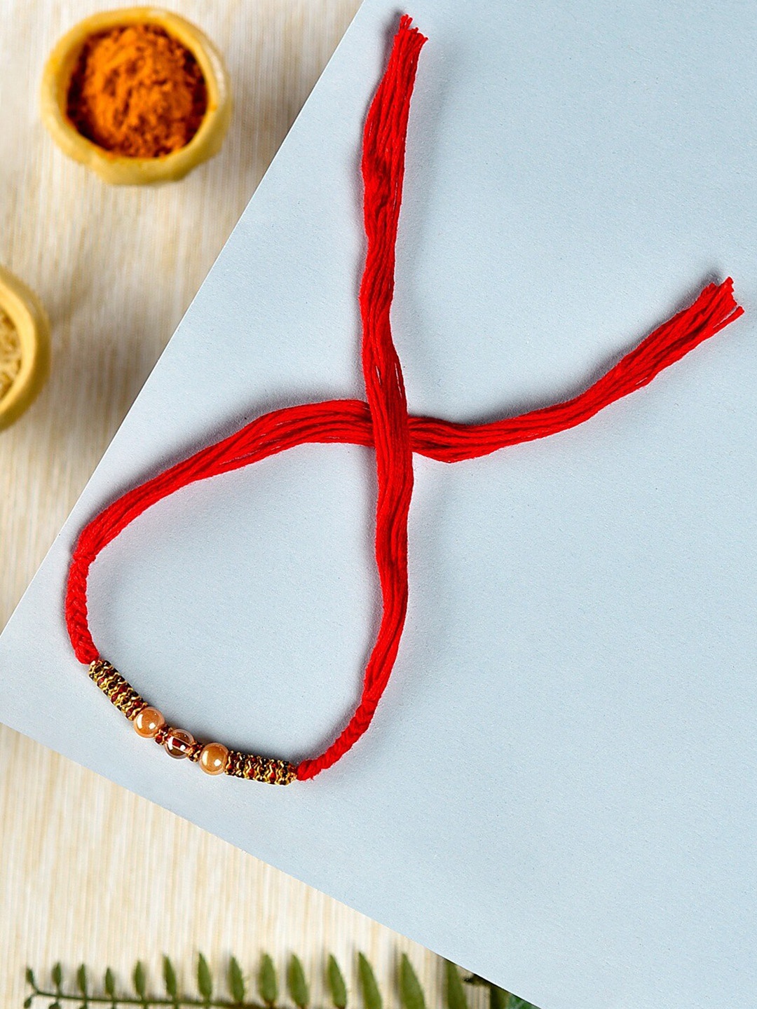 

Zaveri Pearls Beaded Thread Rakhi, Red