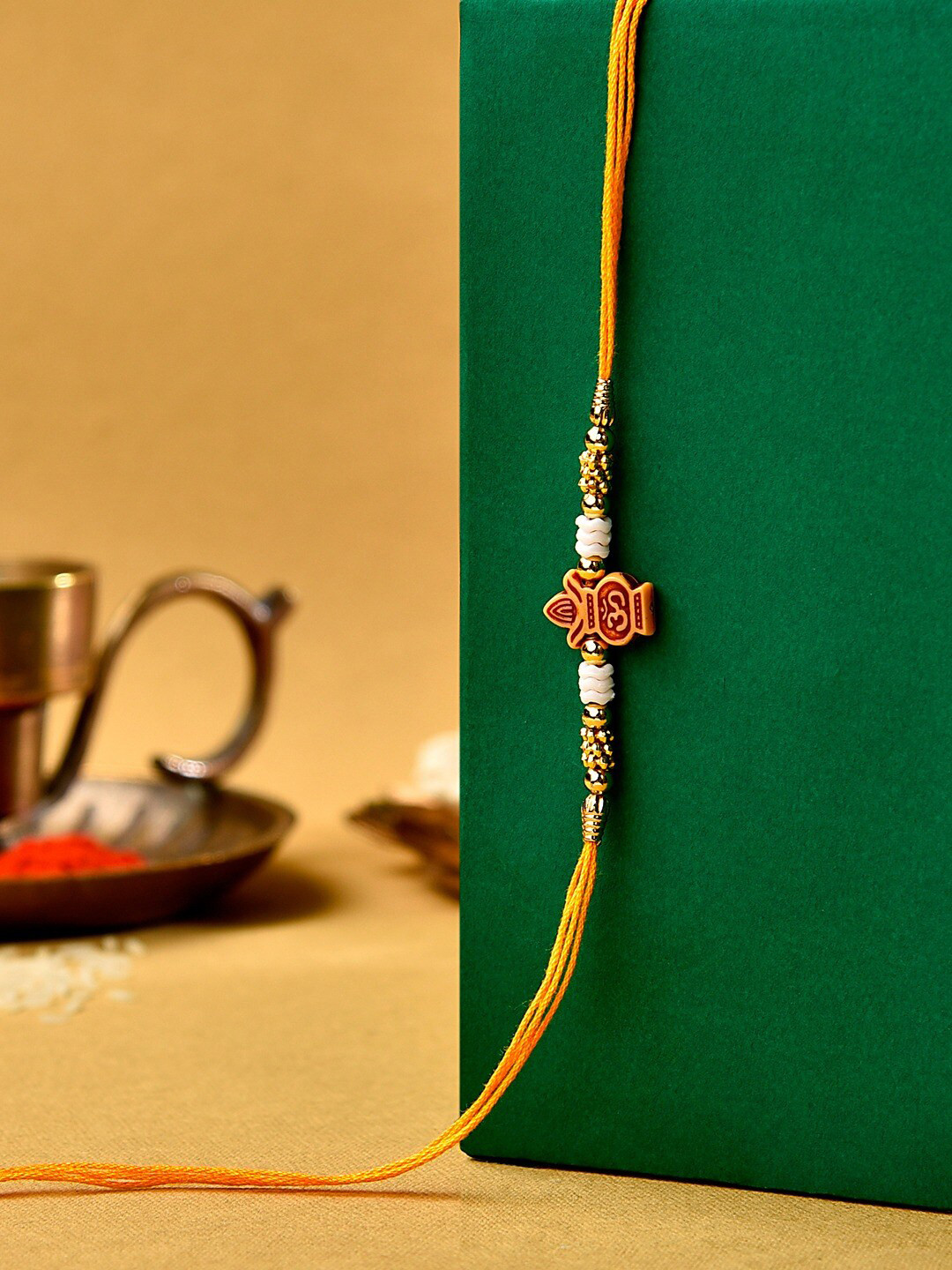 

Zaveri Pearls Beaded Thread Rakhi, Yellow