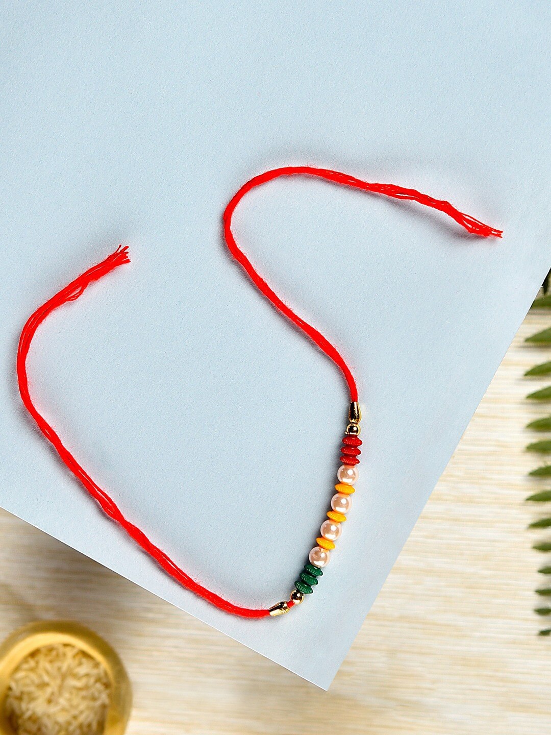 

Zaveri Pearls Beaded Thread Rakhi, Red