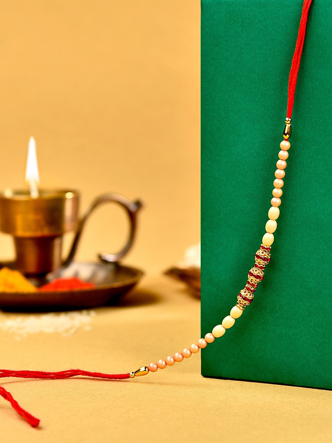 

Zaveri Pearls Beaded Thread Rakhi, Brown