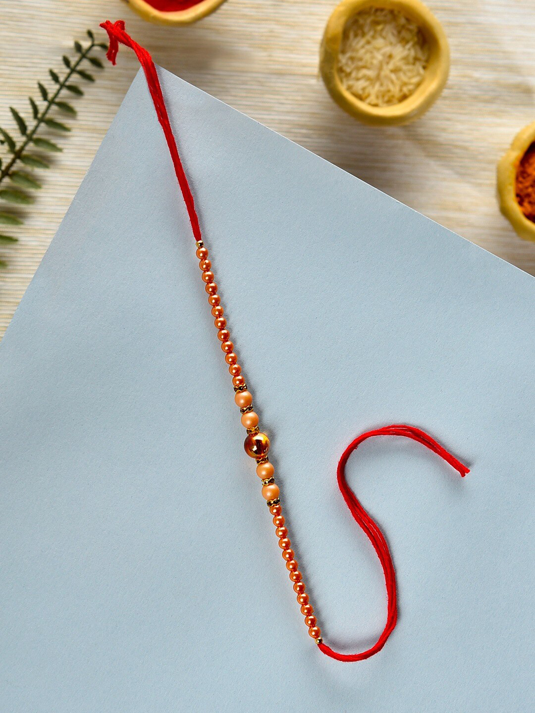 

Zaveri Pearls Beaded Thread Rakhi, Gold