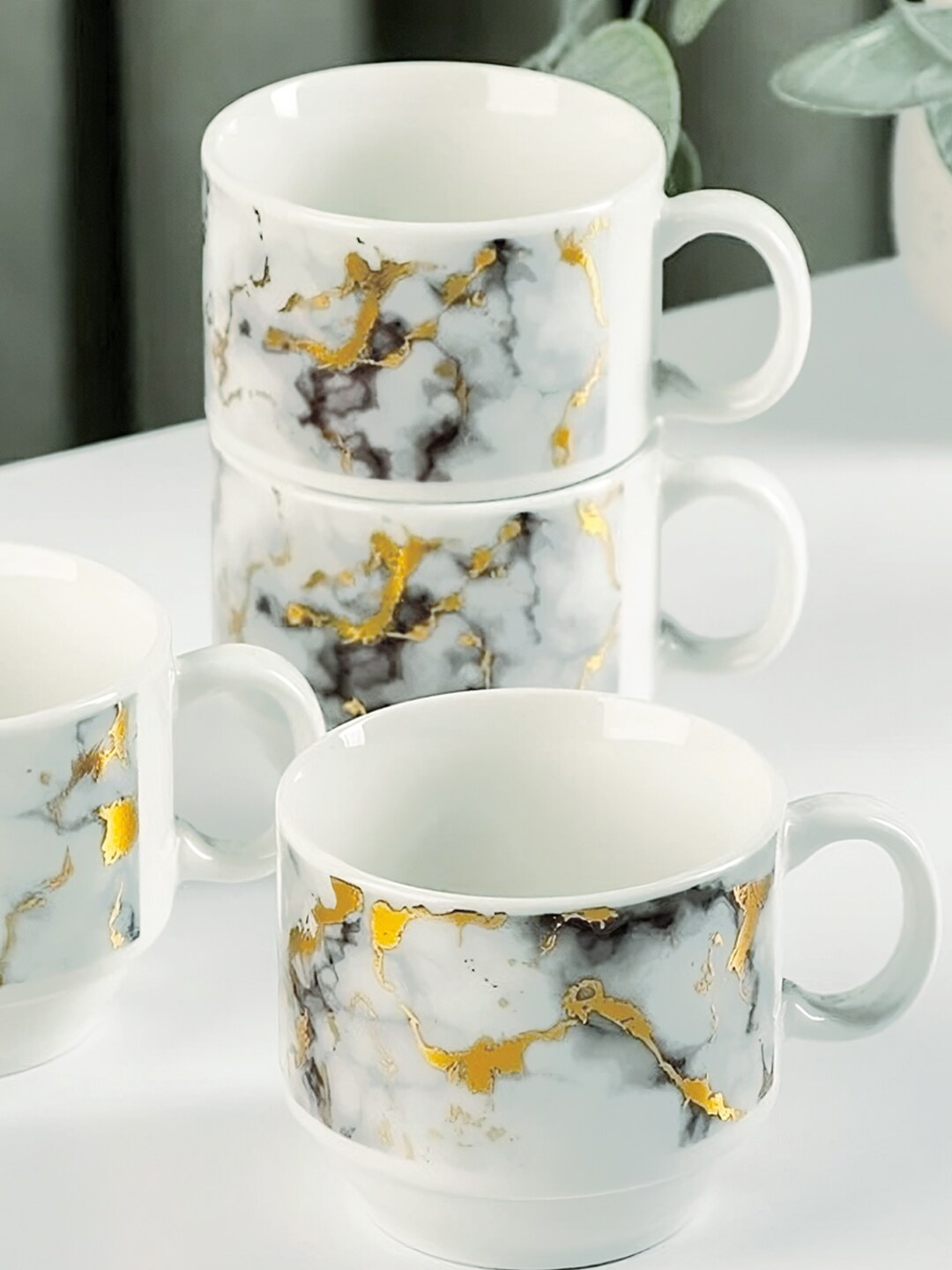 

BonZeaL White & Grey 4 Pcs Printed Ceramic Glossy Mugs With Metal Holder Stand 150 ml each