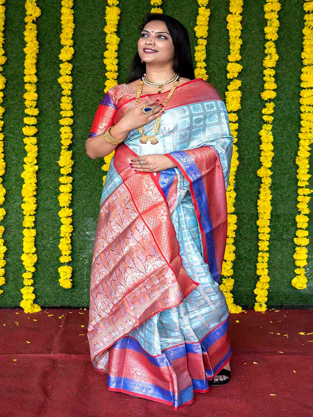 

Mitera Blue & Red Ethnic Motifs Woven Design Zari Saree