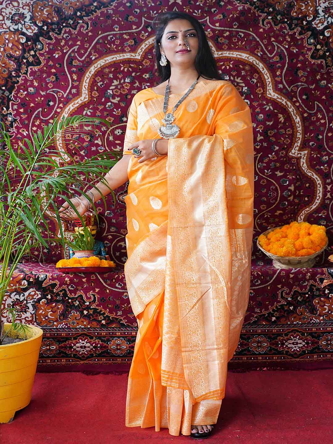 

Mitera Orange & Gold-Toned Ethnic Motifs Woven Design Zari Saree
