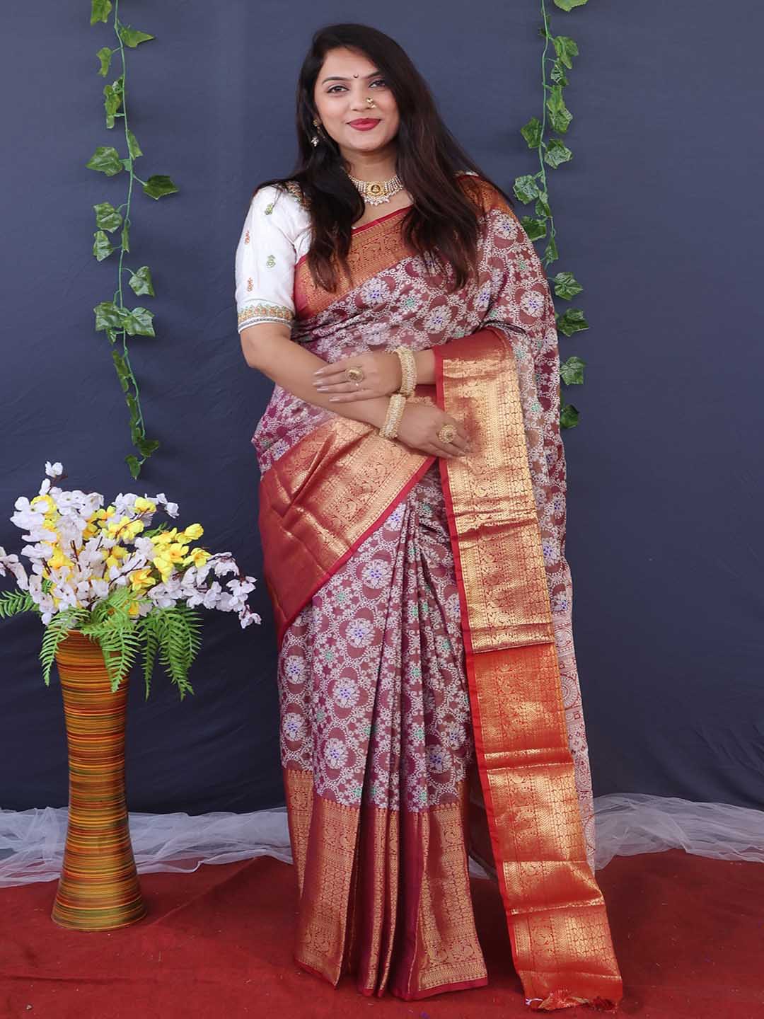 

Mitera Maroon & Red Ethnic Motifs Woven Design Zari Art Silk Saree