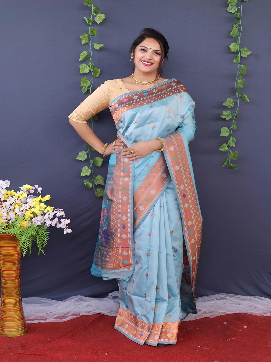 

Mitera Turquoise Blue & Copper-Toned Floral Woven Design Zari Art Silk Saree