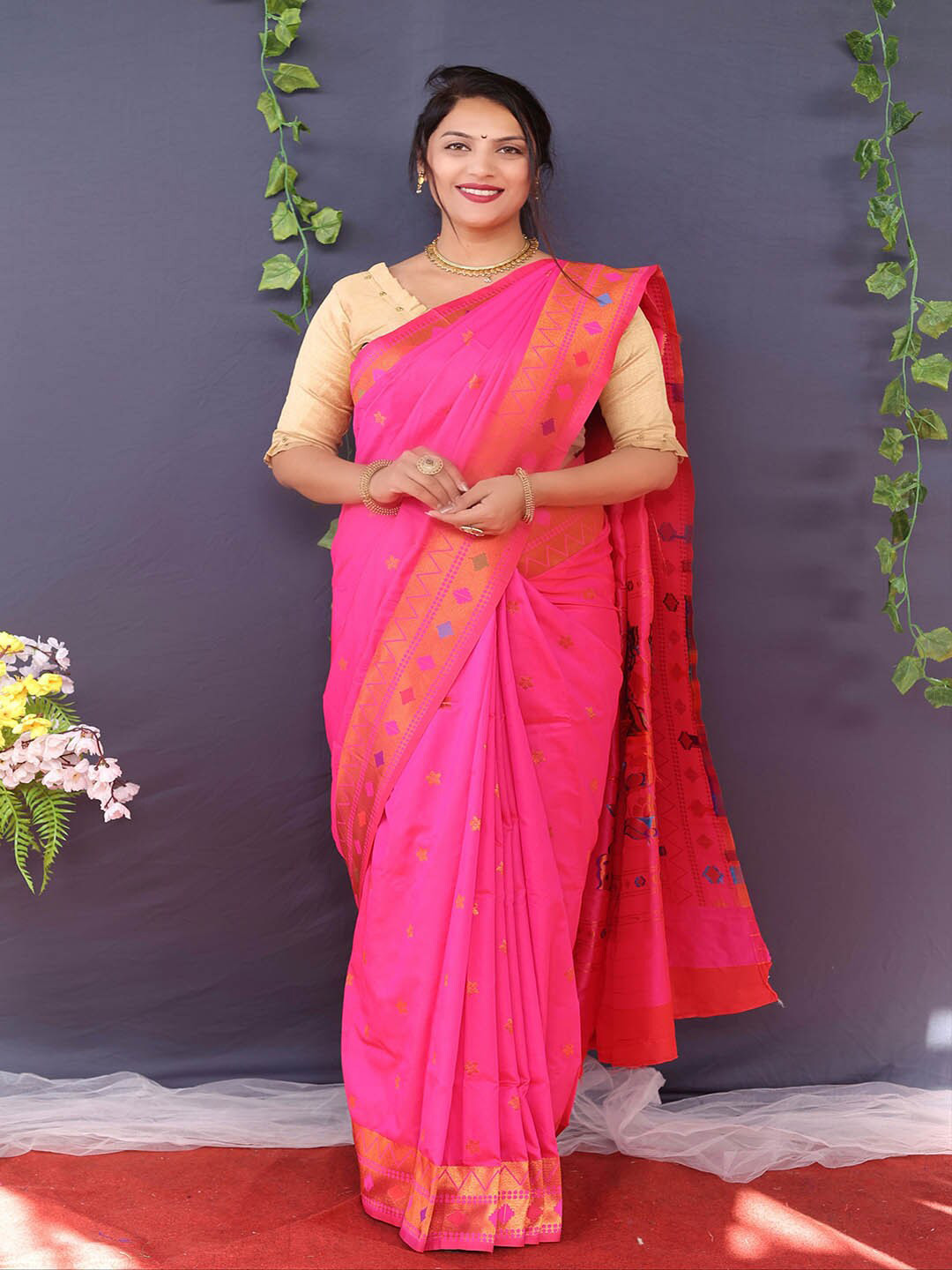 

Mitera Pink & Gold-Toned Ethnic Motifs Woven Design Zari Saree