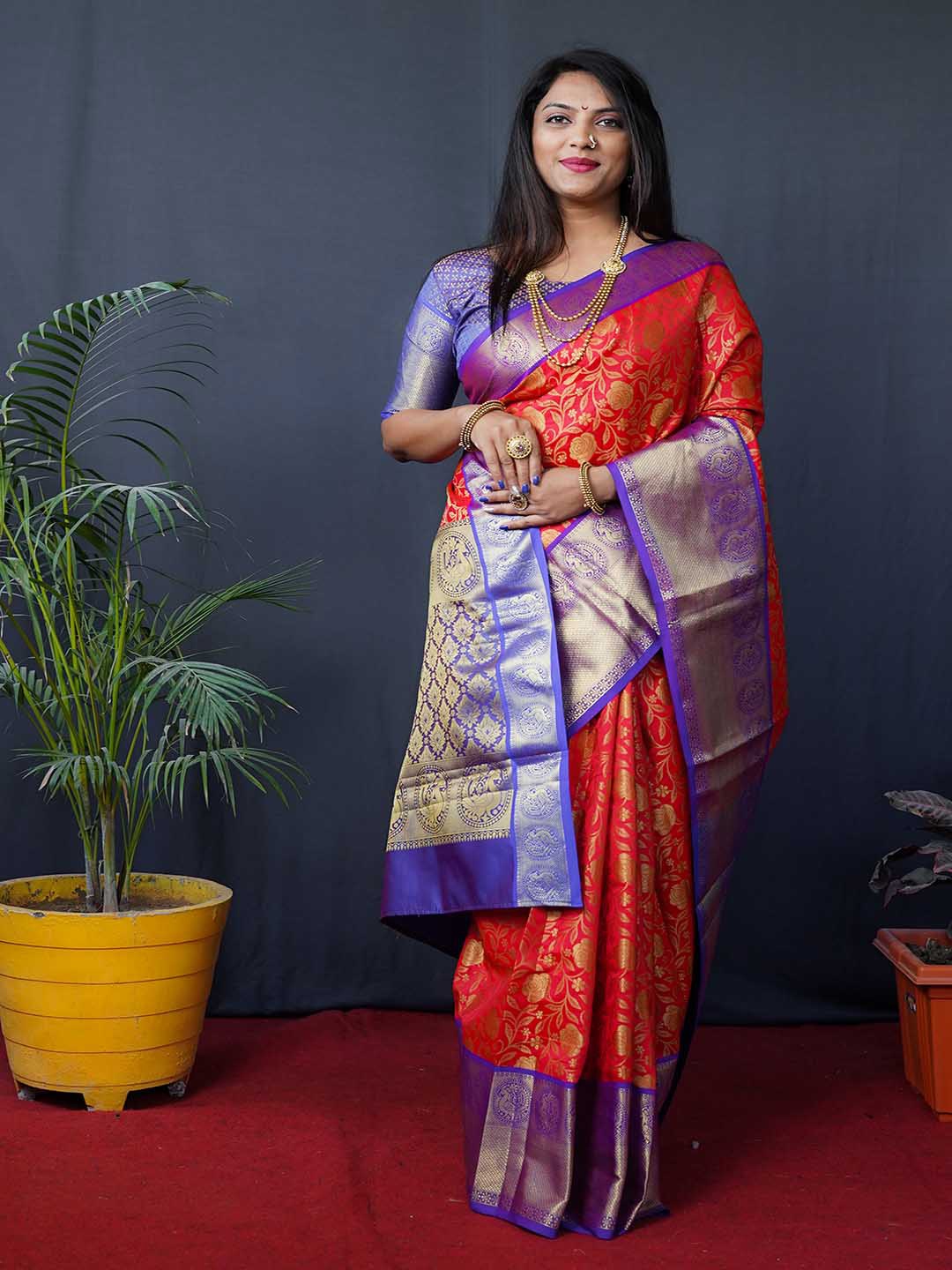 

Mitera Red & Blue Ethnic Motifs Woven Design Zari Kanchipuram Saree