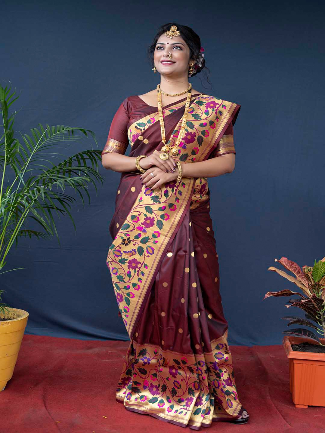 

Mitera Maroon & Green Ethnic Motifs Woven Design Zari Art Silk Saree