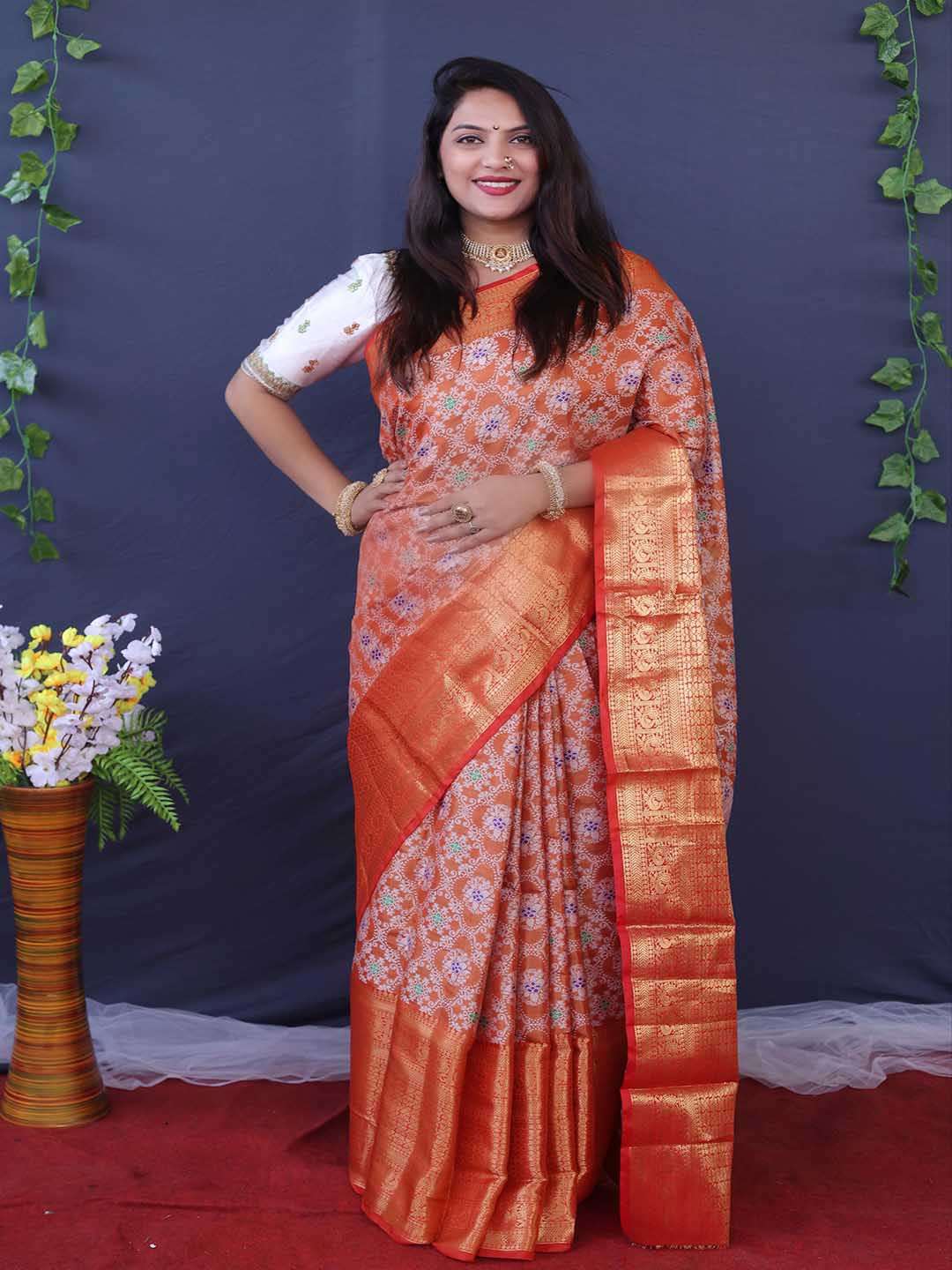 

Mitera Orange & White Ethnic Motif Printed Zari Saree