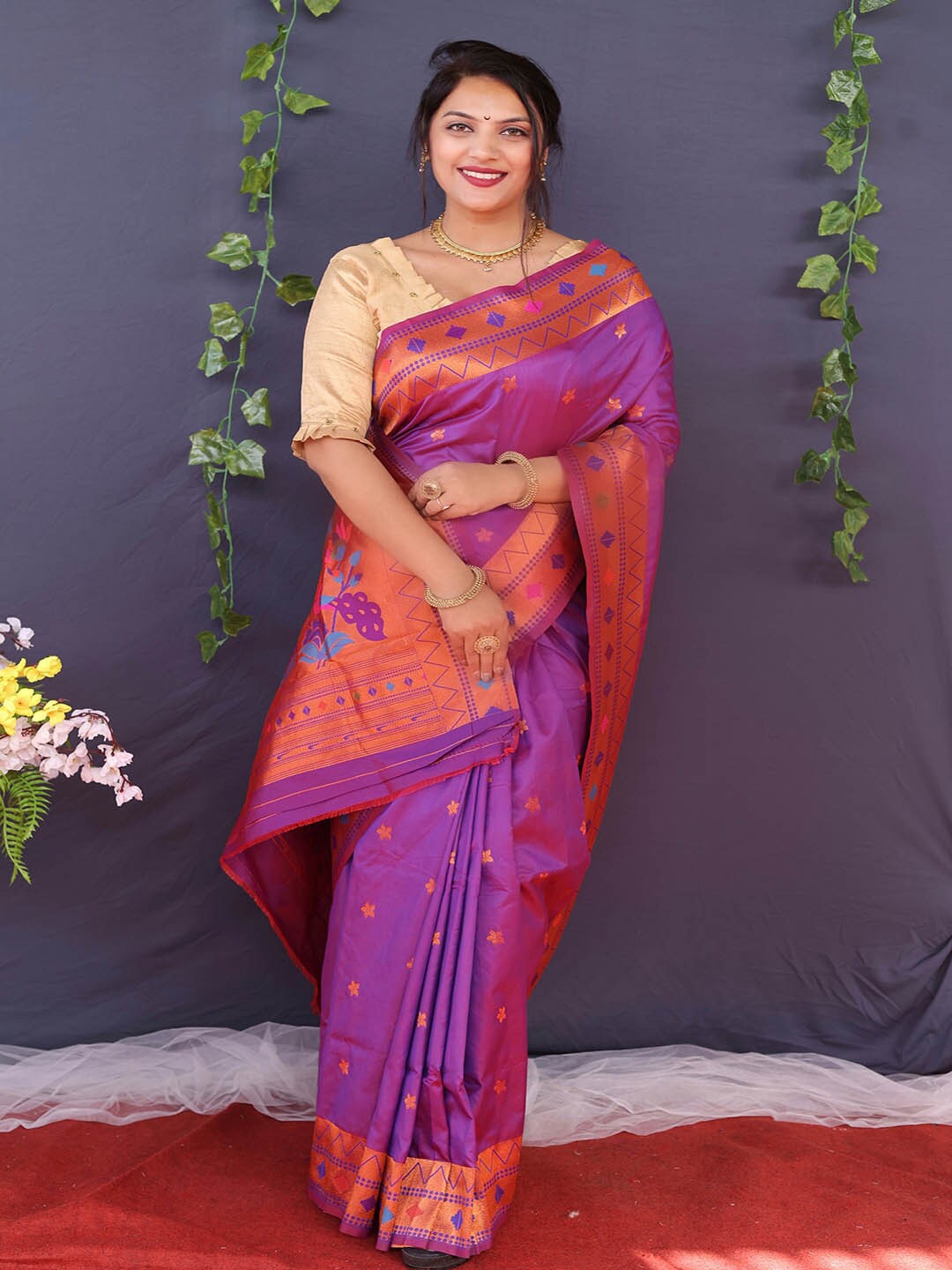 

Mitera Purple & Gold-Toned Ethnic Motifs Woven Design Zari Saree