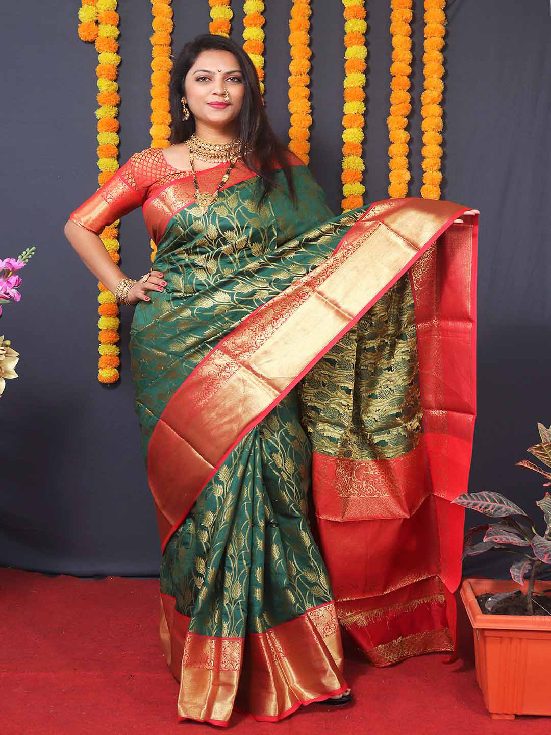 

Mitera Green & Red Floral Woven Design Zari Art Silk Saree