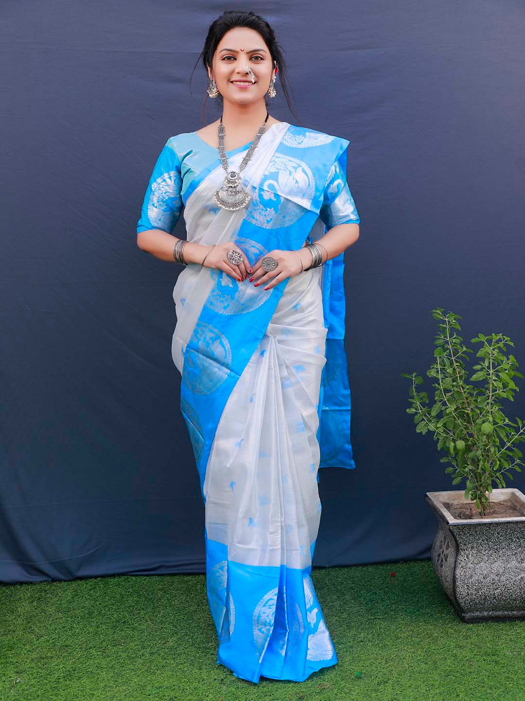 

Mitera Blue & Silver-Toned Ethnic Motifs Woven Design Zari Tissue Saree